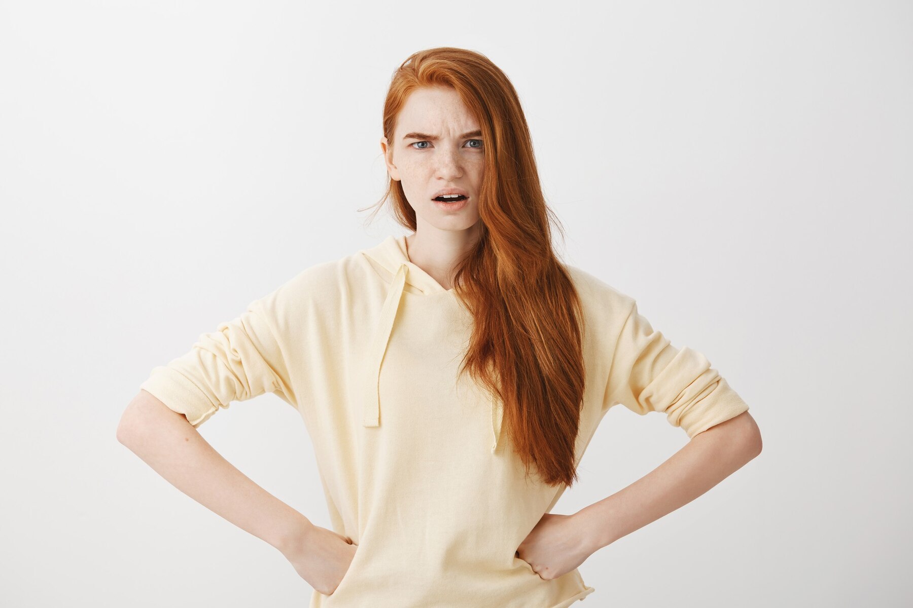 An angry red-headed woman | Source: Freepik