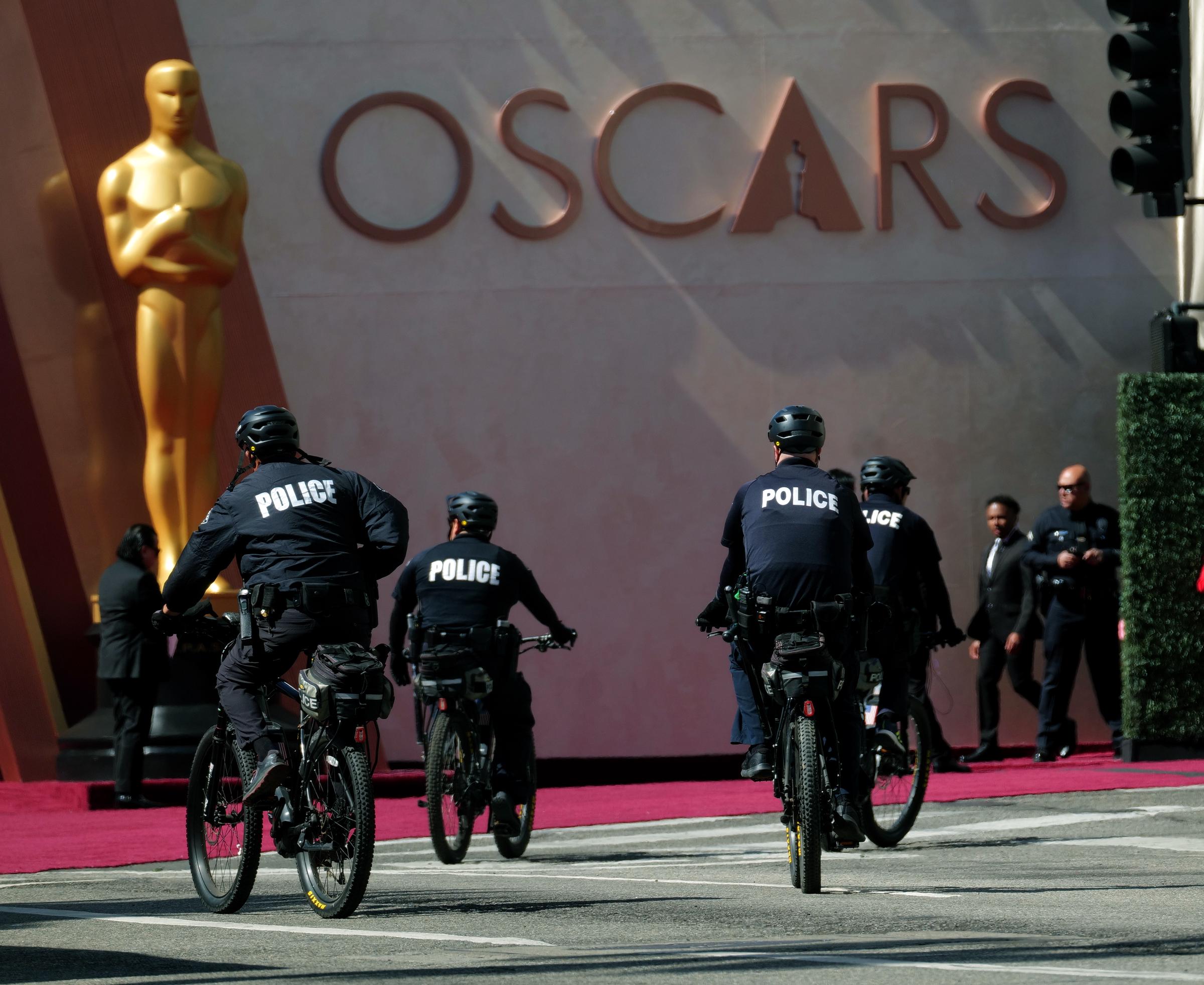 The Los Angeles Police Department patrol on bicycles as people protest as cars arrived for the Oscars on March 2, 2025 in Hollywood, California | Source: Getty Images