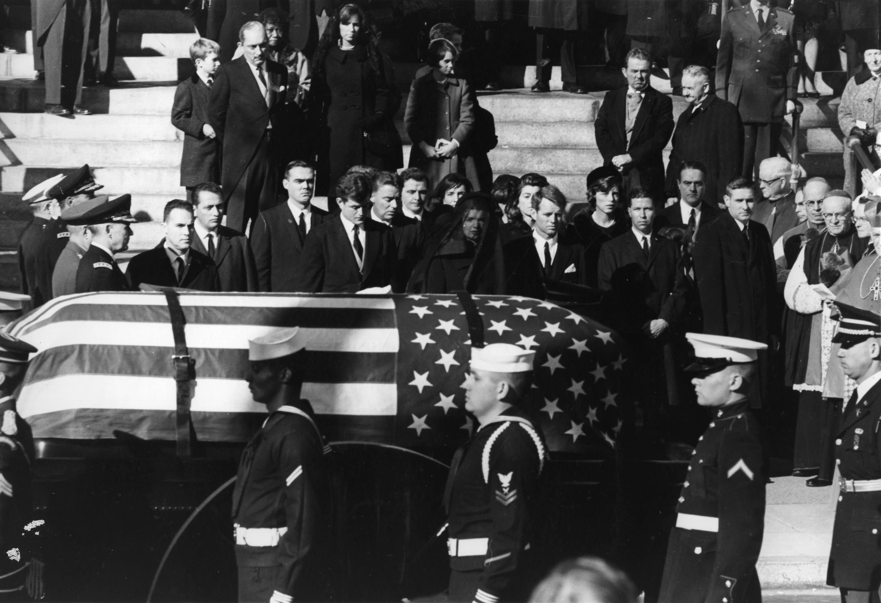 President John F. Kennedy's coffin photographed surrounded by loved ones during his state funeral on November 25, 1963. | Source: Getty Images