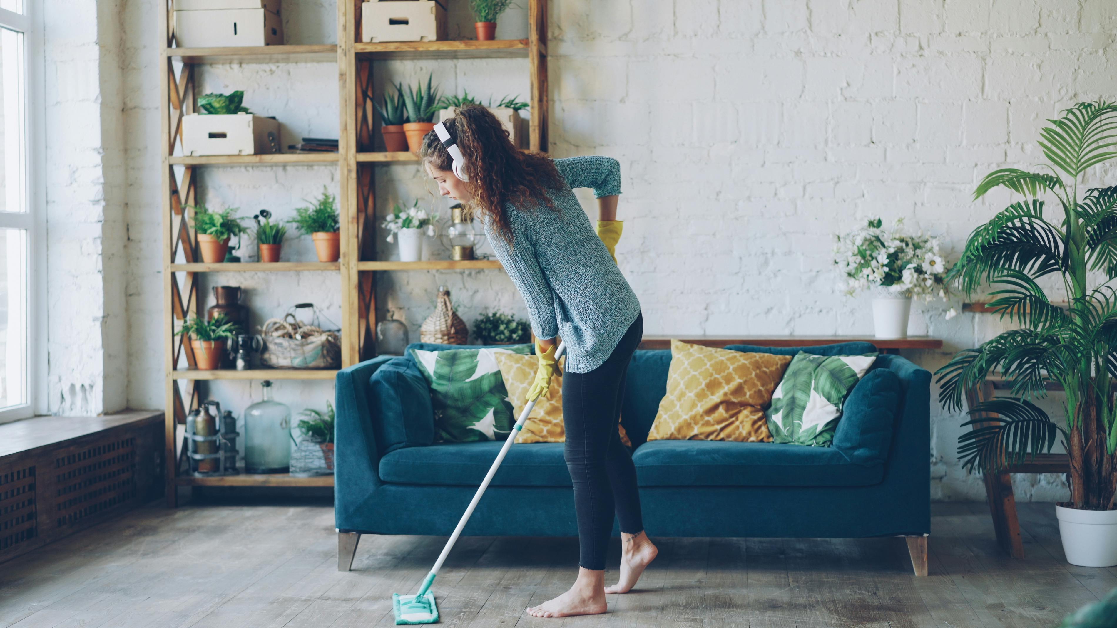 A woman cleaning her living room | Source: Pexels