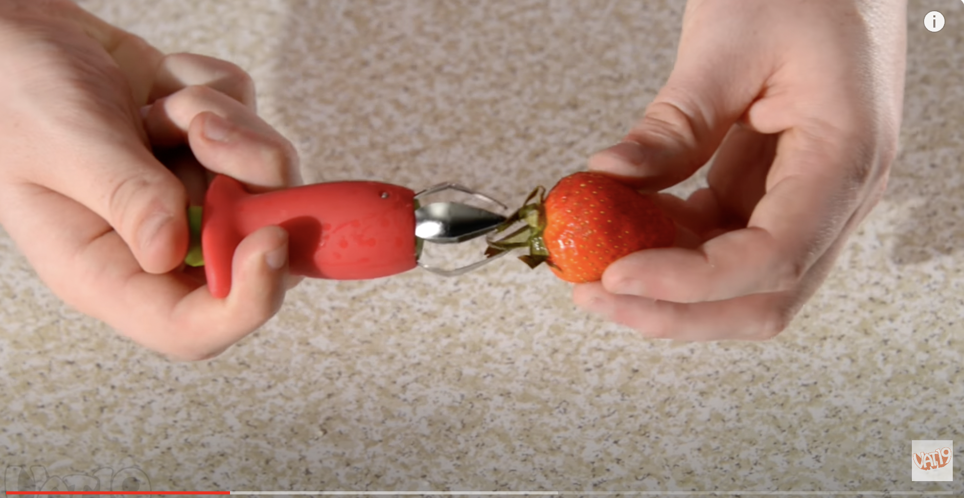 A stem remover removing a strawberry's stem. | Source: Youtube/Vat19