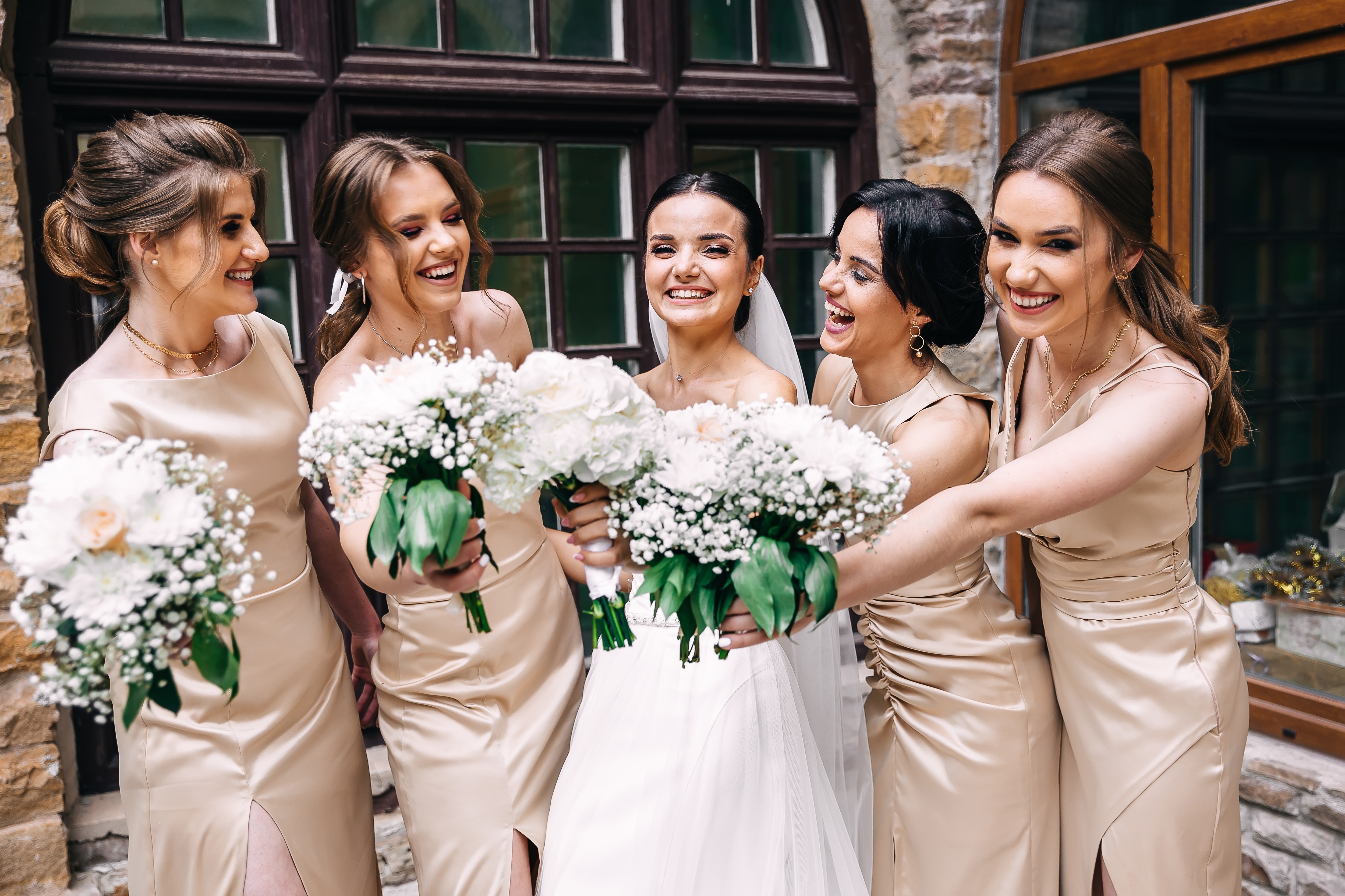 A happy bridal party posing for a photo | Source: Shutterstock
