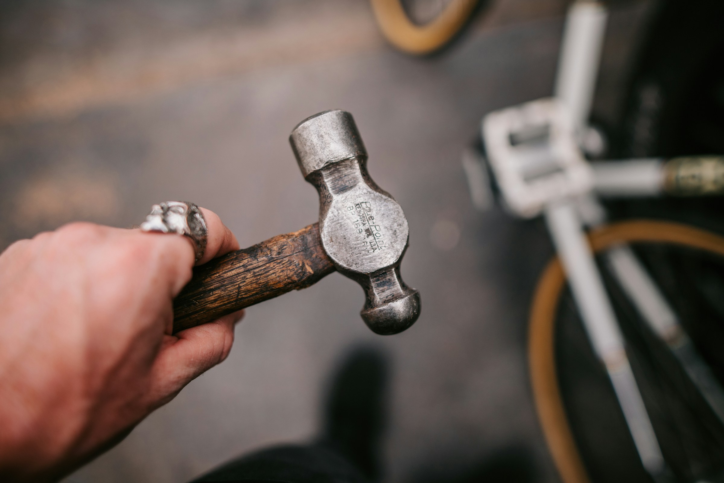 A man holding a hammer | Source: Unsplash