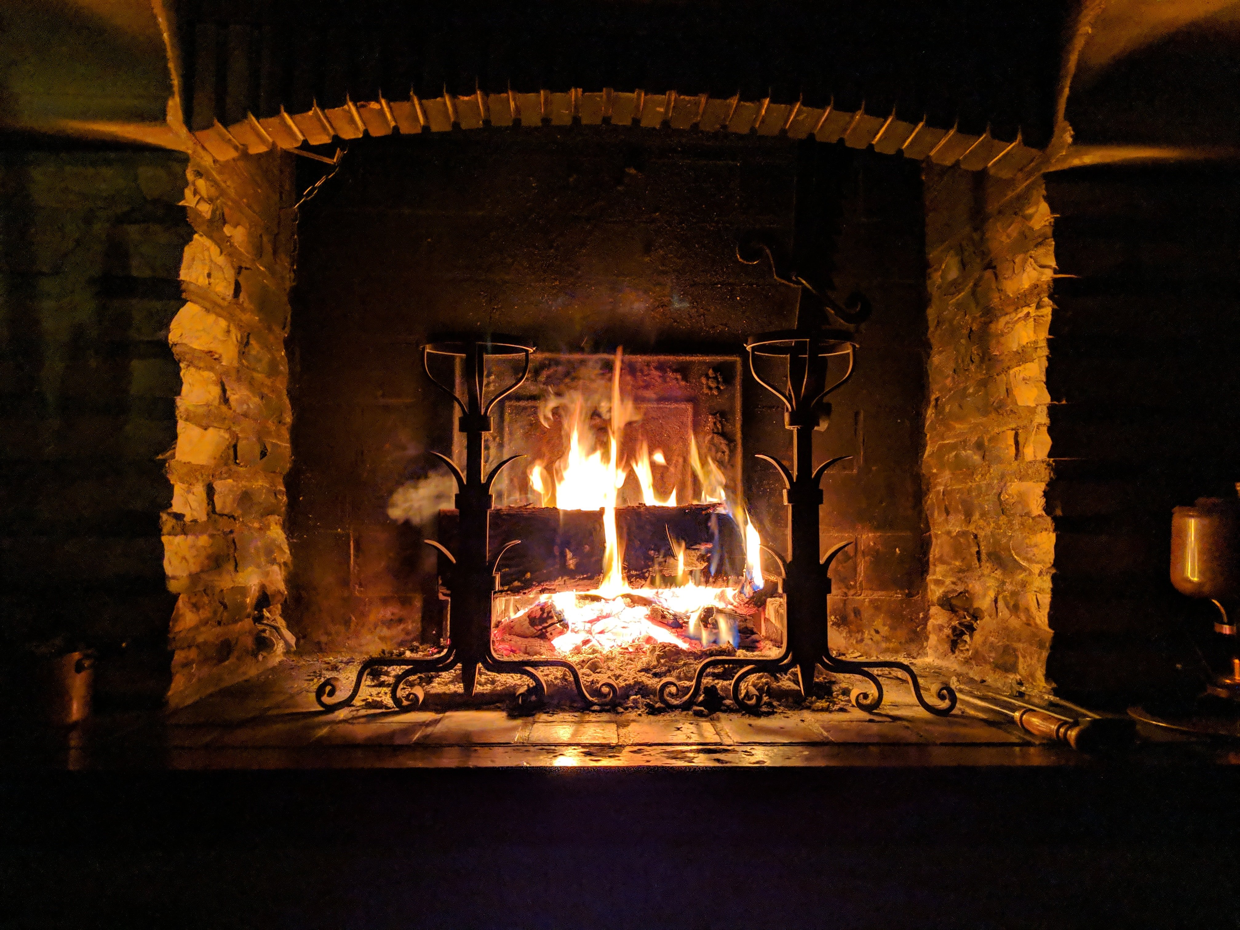 Justin and Kyle toasted their sandwiches in the old fireplace. | Source: Unsplash