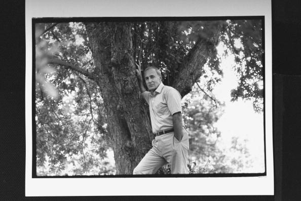 Leo Damore posing against a tree in yard at home, circa 1989. | Photo: Getty Images