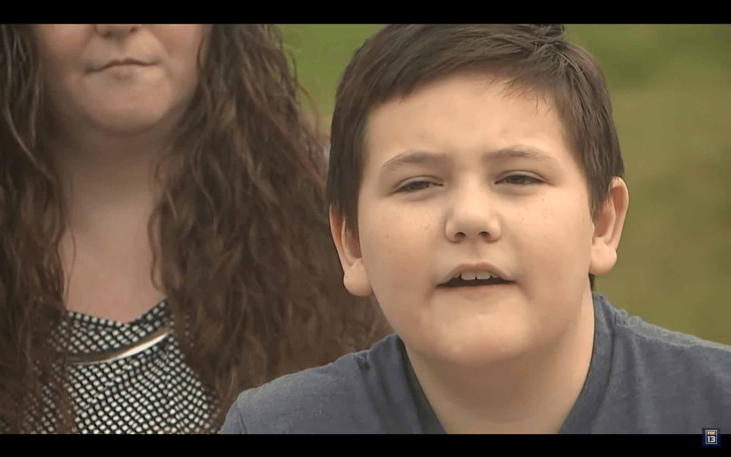 Boy whose desk was placed in the bathroom with his mom. | Photo: YouTube/FOX 13 Seattle