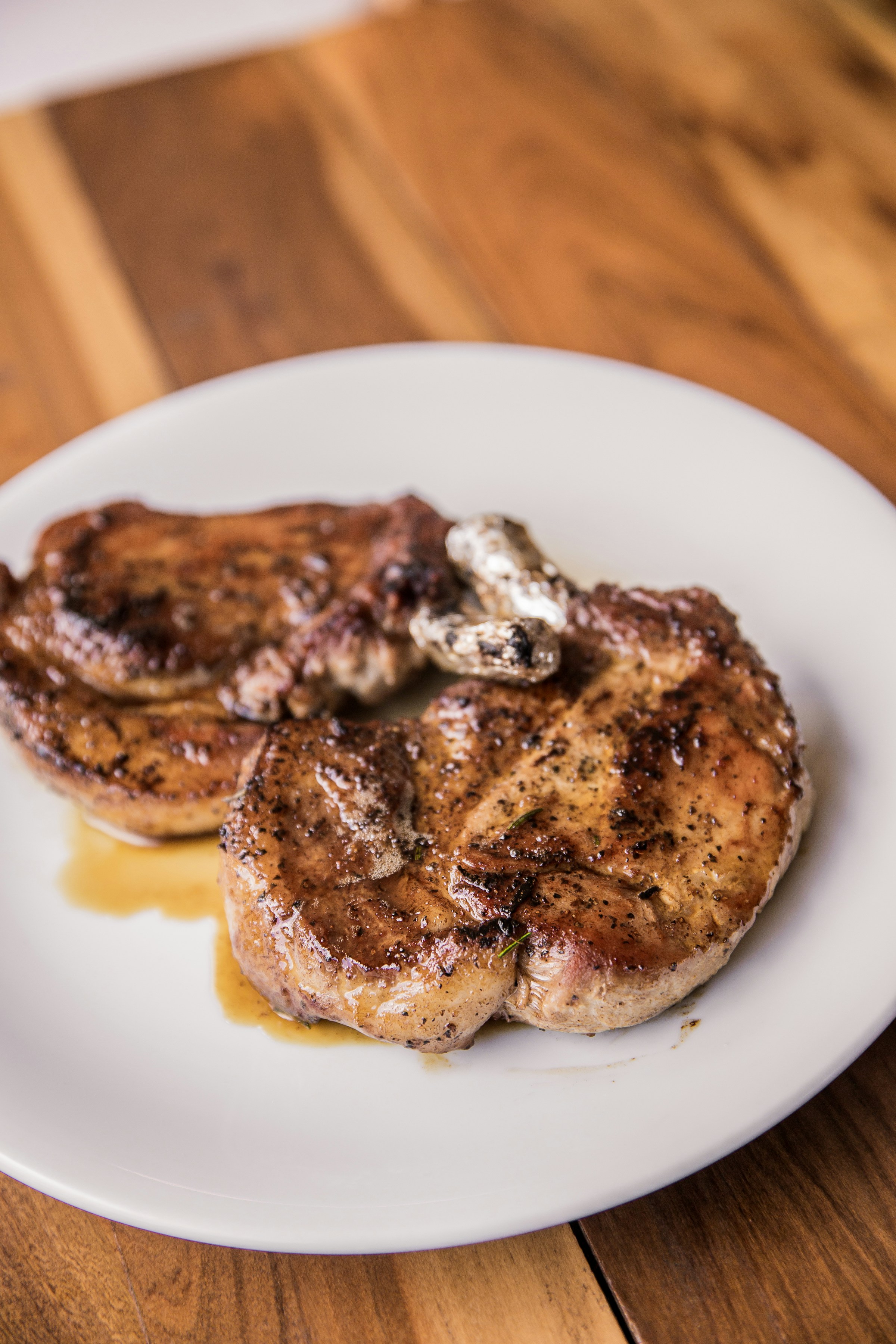 Pork chops on a plate | Source: Unsplash