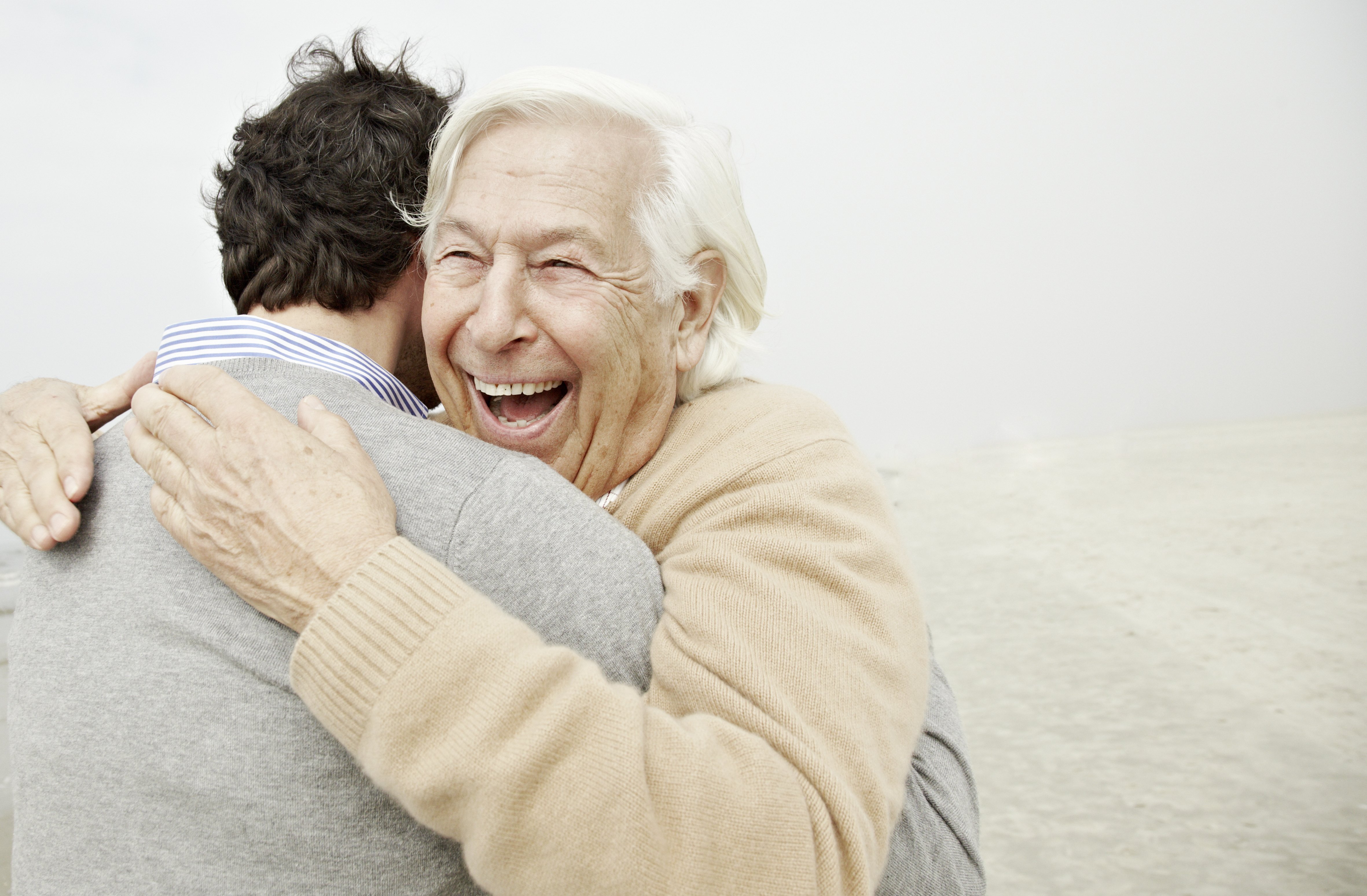 A happy father hugs his son. | Source: Getty Images 