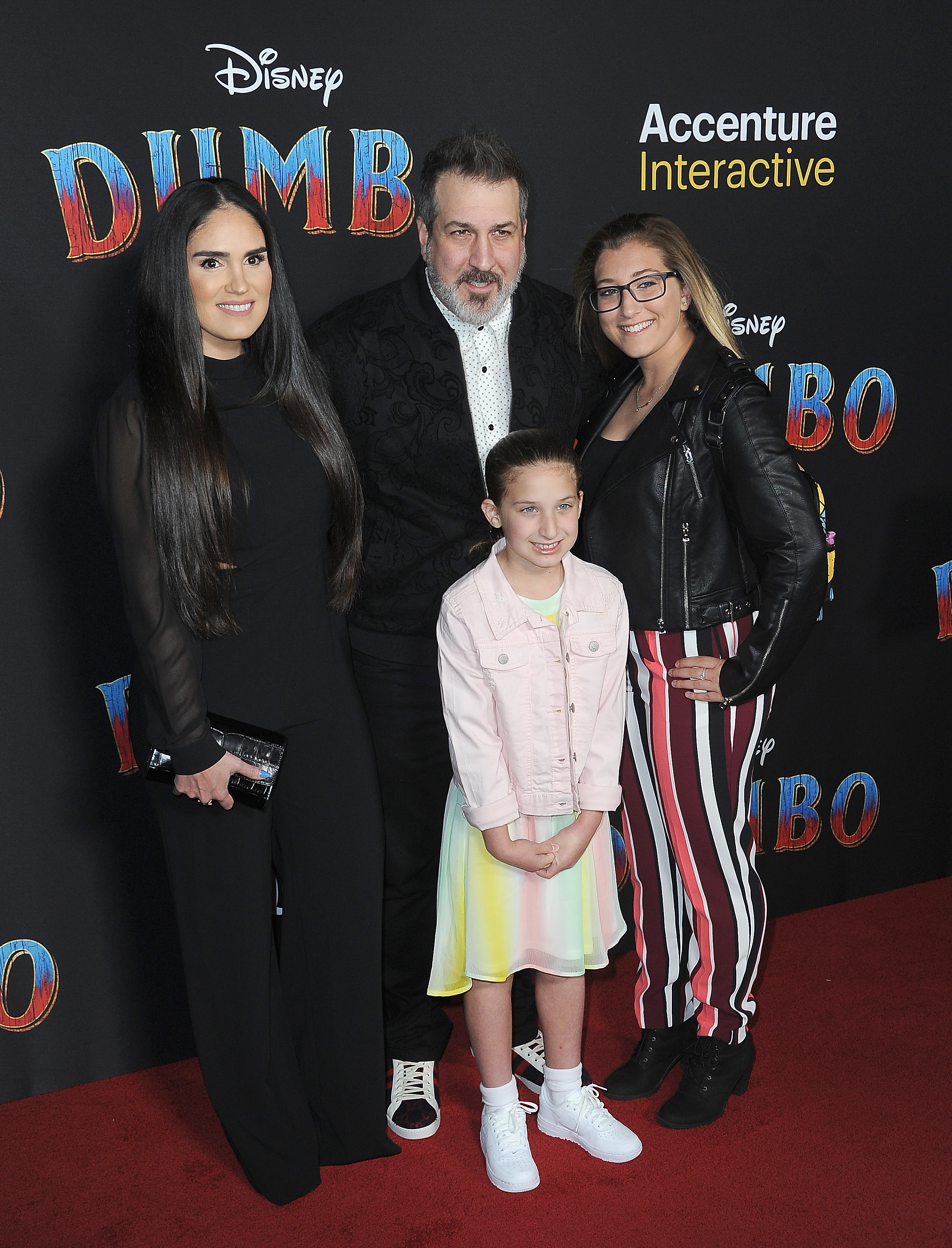 Izabel Araujo, Joey Fatone, and his daughters at the premiere of Disney's "Dumbo" at El Capitan Theatre, on March 11, 2019, in Los Angeles, California. | Source: Getty Images