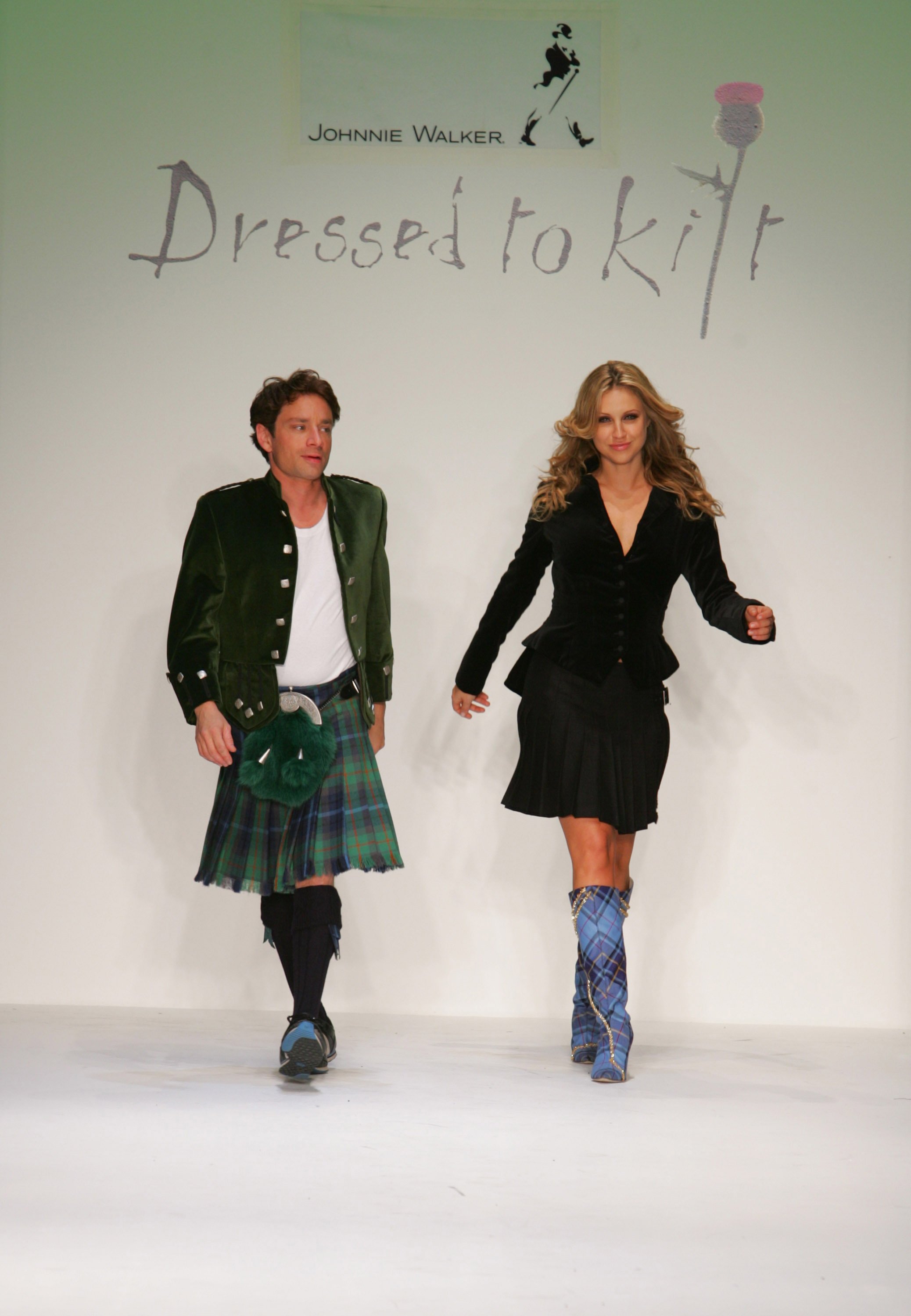 Chris Kattan and Sunshine Deia Tutt walk the runway for the Johnnie Walker presents "Dressed to Kilt" on October 14, 2006, in Los Angeles, California. | Source: Getty Images