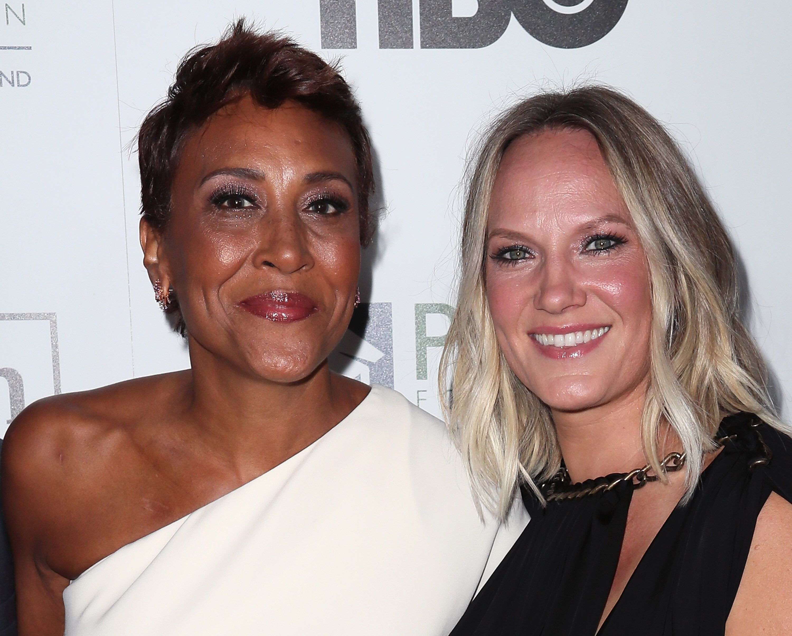 Broadcaster Robin Roberts (L) and partner Amber Laign attend the 2016 Point Honors Los Angeles Gala at The Beverly Hilton Hotel  | Getty Images