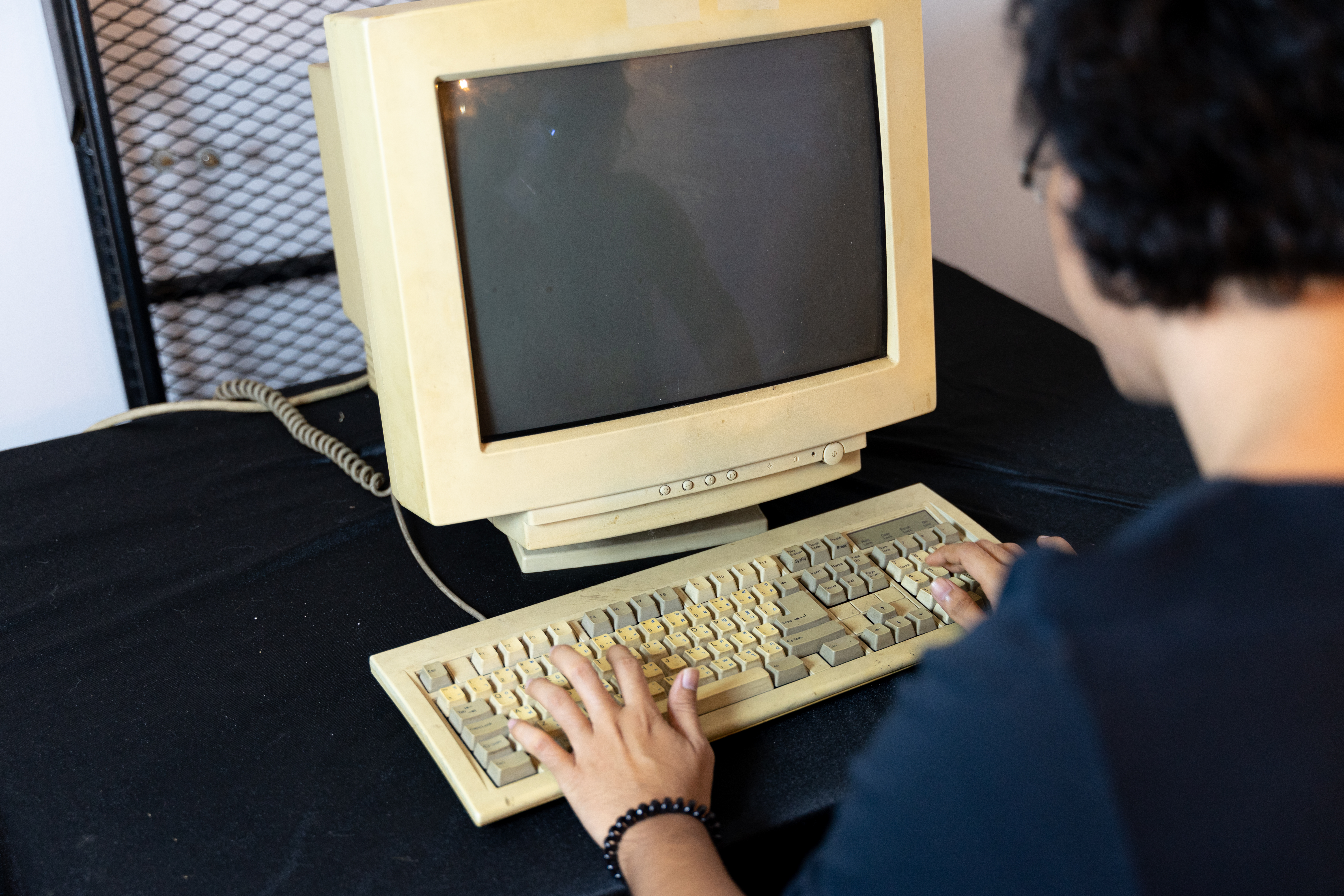 Old personal computer with man type the code | Source: Shutterstock.com