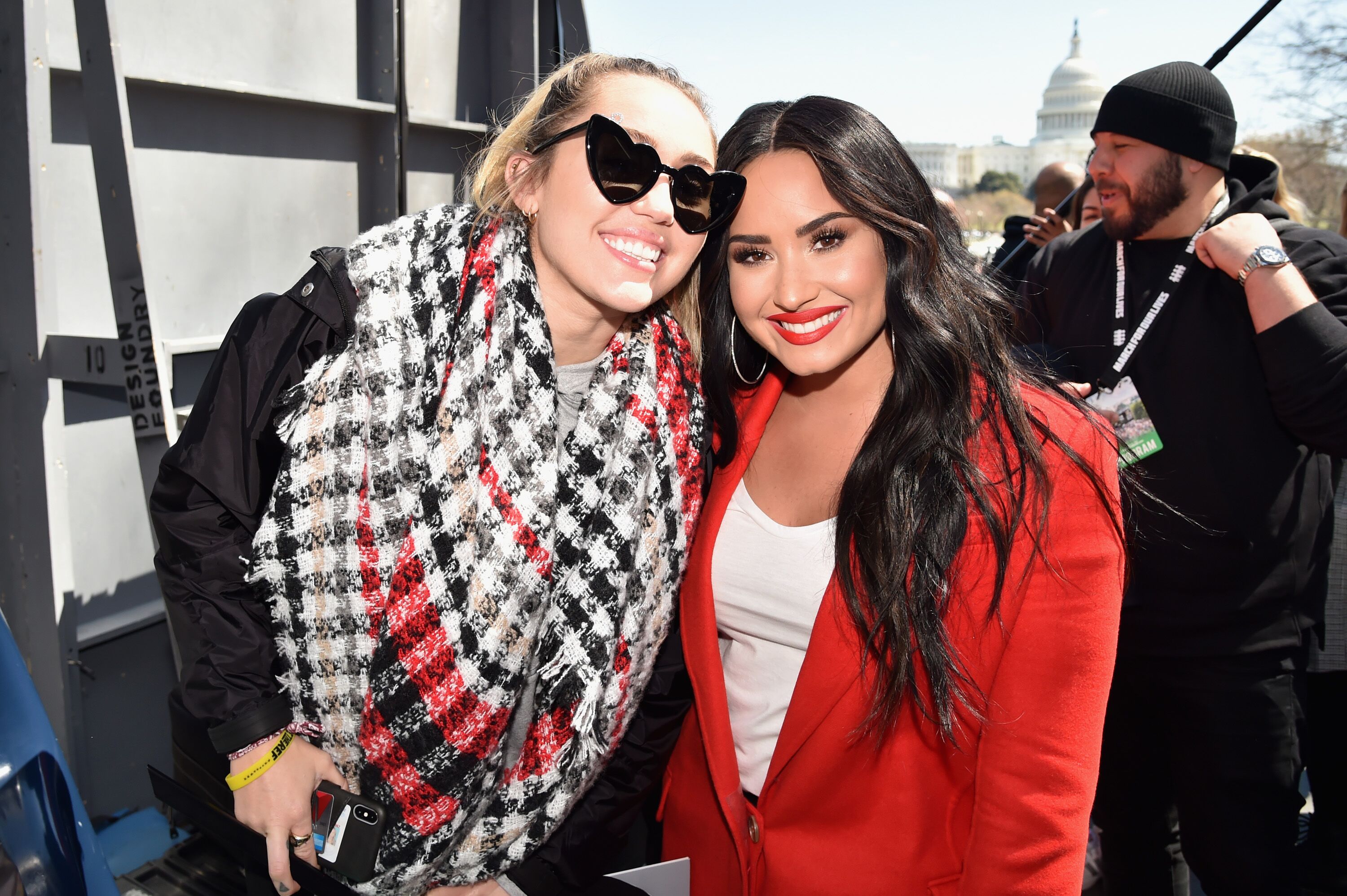 Miley Cyrus and Demi Lovato attend March For Our Lives on March 24, 2018 in Washington, DC. | Source: Getty Images