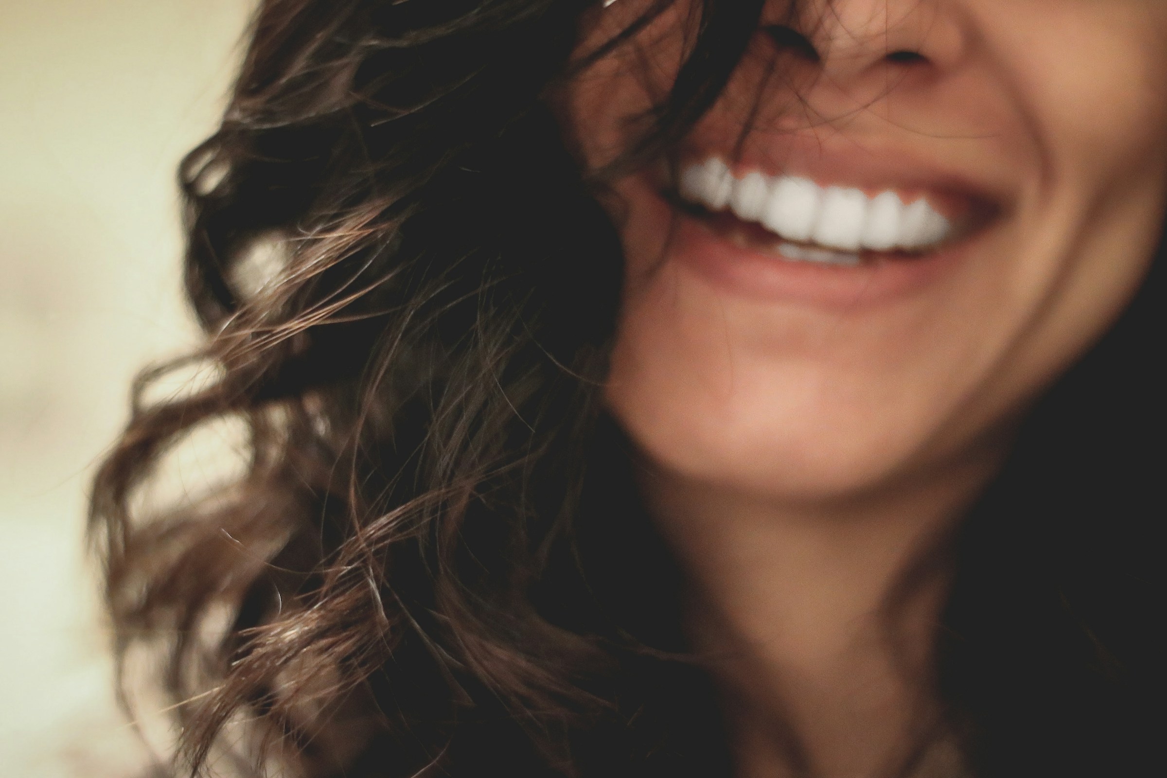 A woman grinning | Source: Unsplash