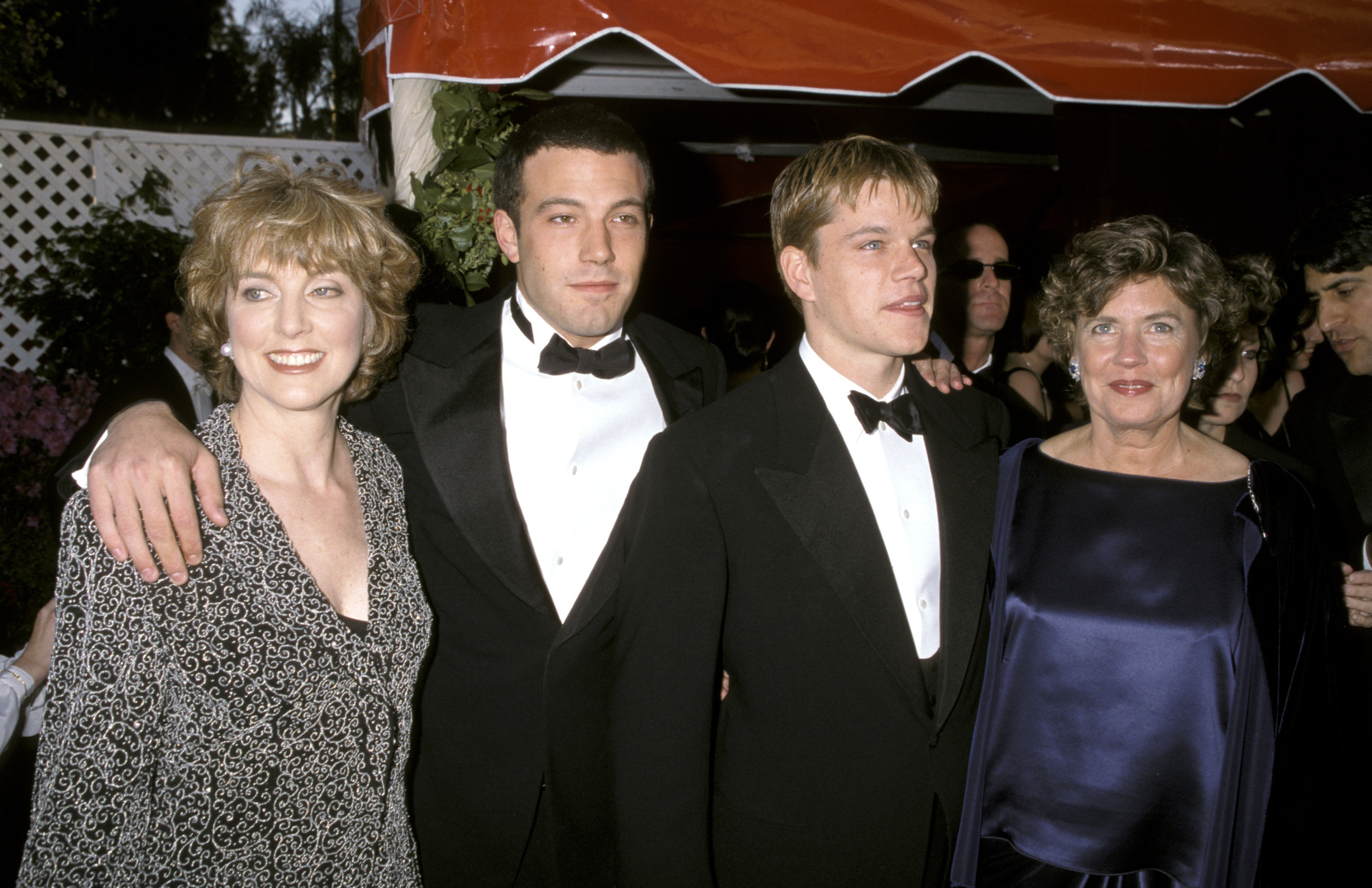 She was a trailblazer who paved the way for her son's iconic career. In this photo, Chris Affleck, Ben Affleck, Matt Damon, and his mother Nancy Carlson-Paige attended the red carpet for the 70th Annual Academy Awards on March 23, 1998, in Los Angeles, California. | Source: Getty Images