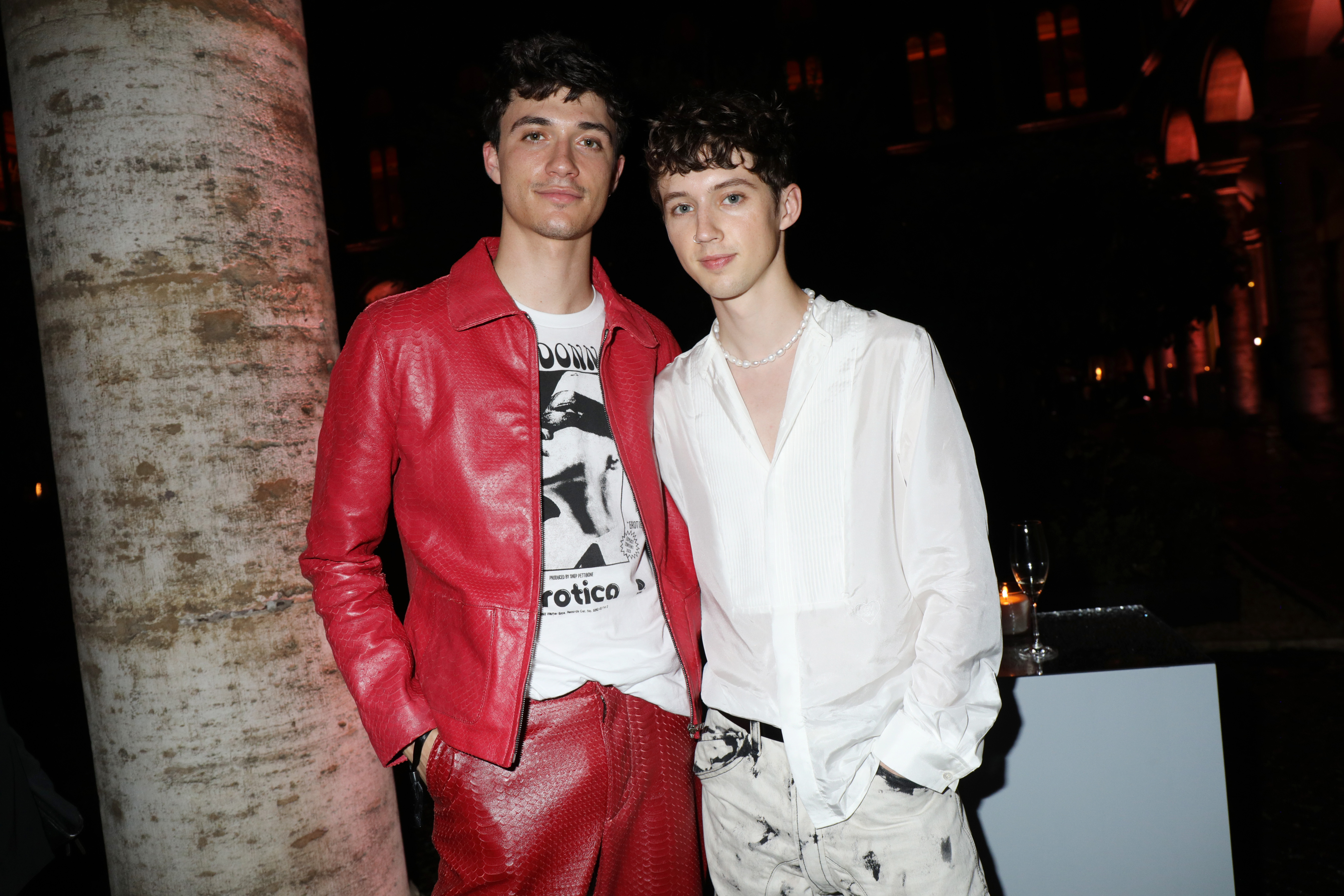 Jacob Bixenman and Troye Sivan attend 'Giambattista Valli Loves H&M Cocktail Dinatorie,' on October 24, 2019 in Rome, Italy. | Source: Getty Images