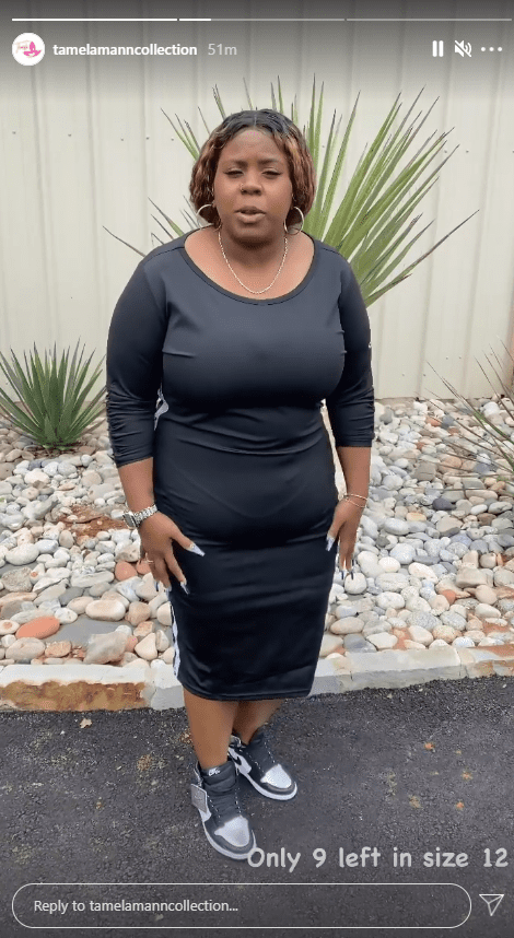 Tia Mann showcases a dress from her mother's clothing brand, Tamela Mann Collection | Photo: Instagram/tamelamanncollection