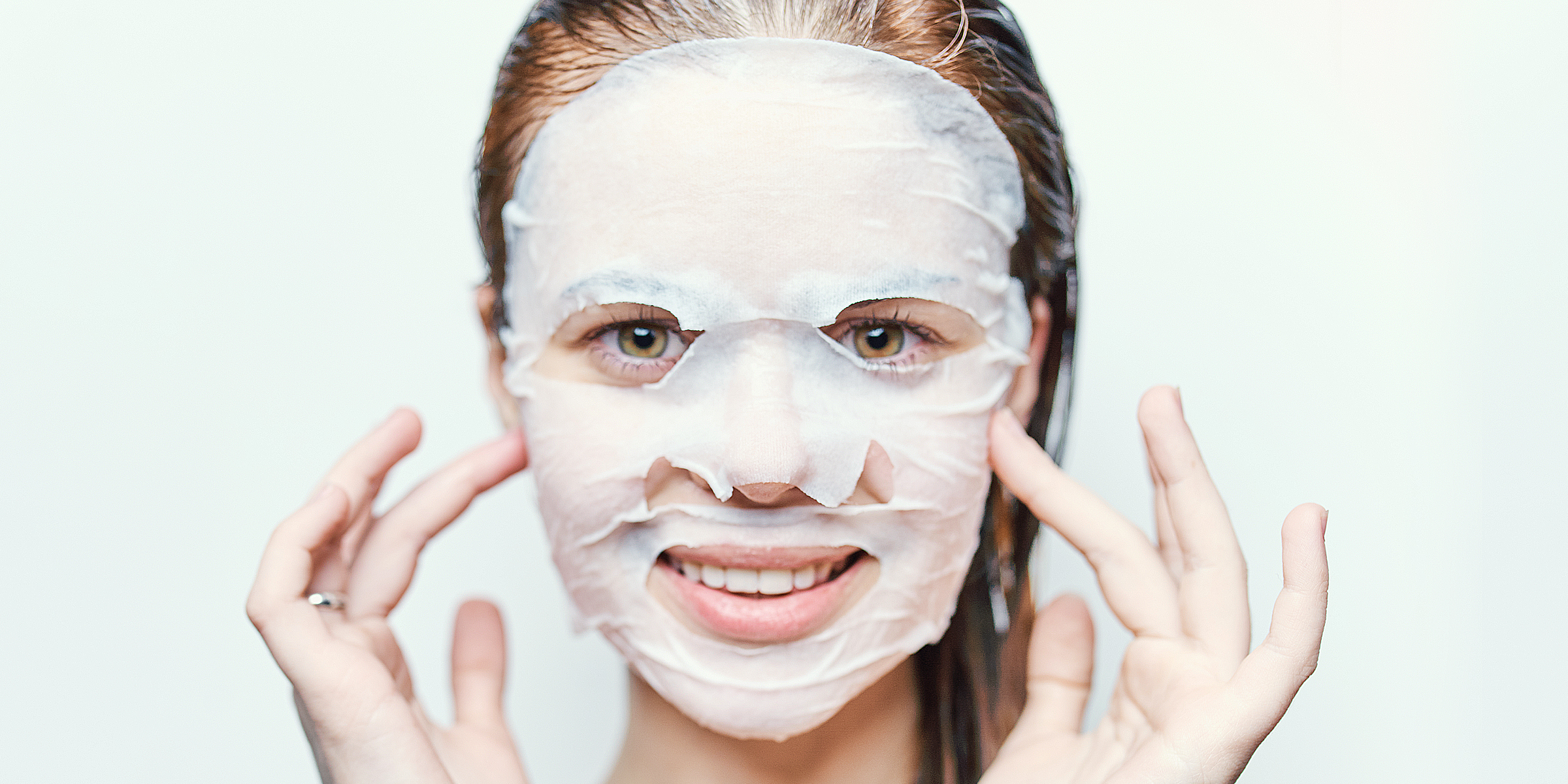 A woman with a sheet mask | Source: Shutterstock