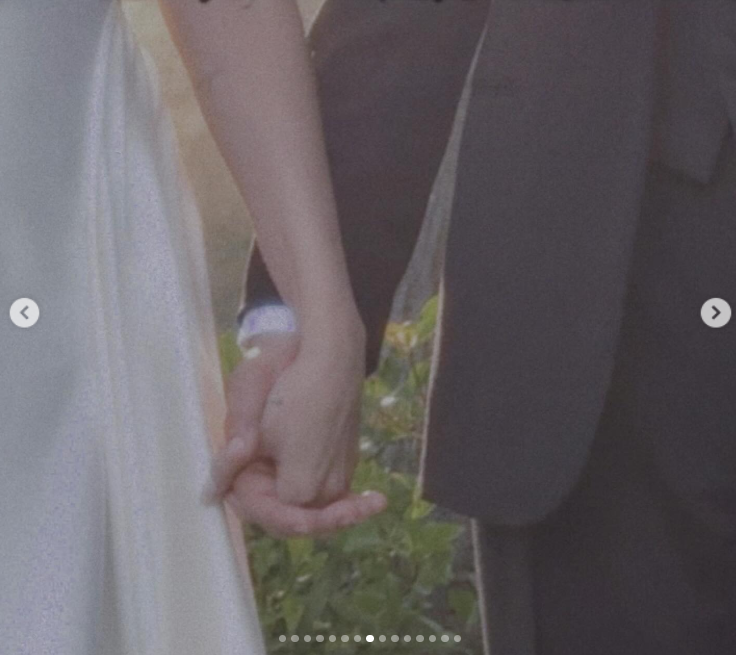 Selena Gomez and Benny Blanco hold hands during their wedding day, as posted on September 27, 2025 | Source: Instagram/selenagomeza