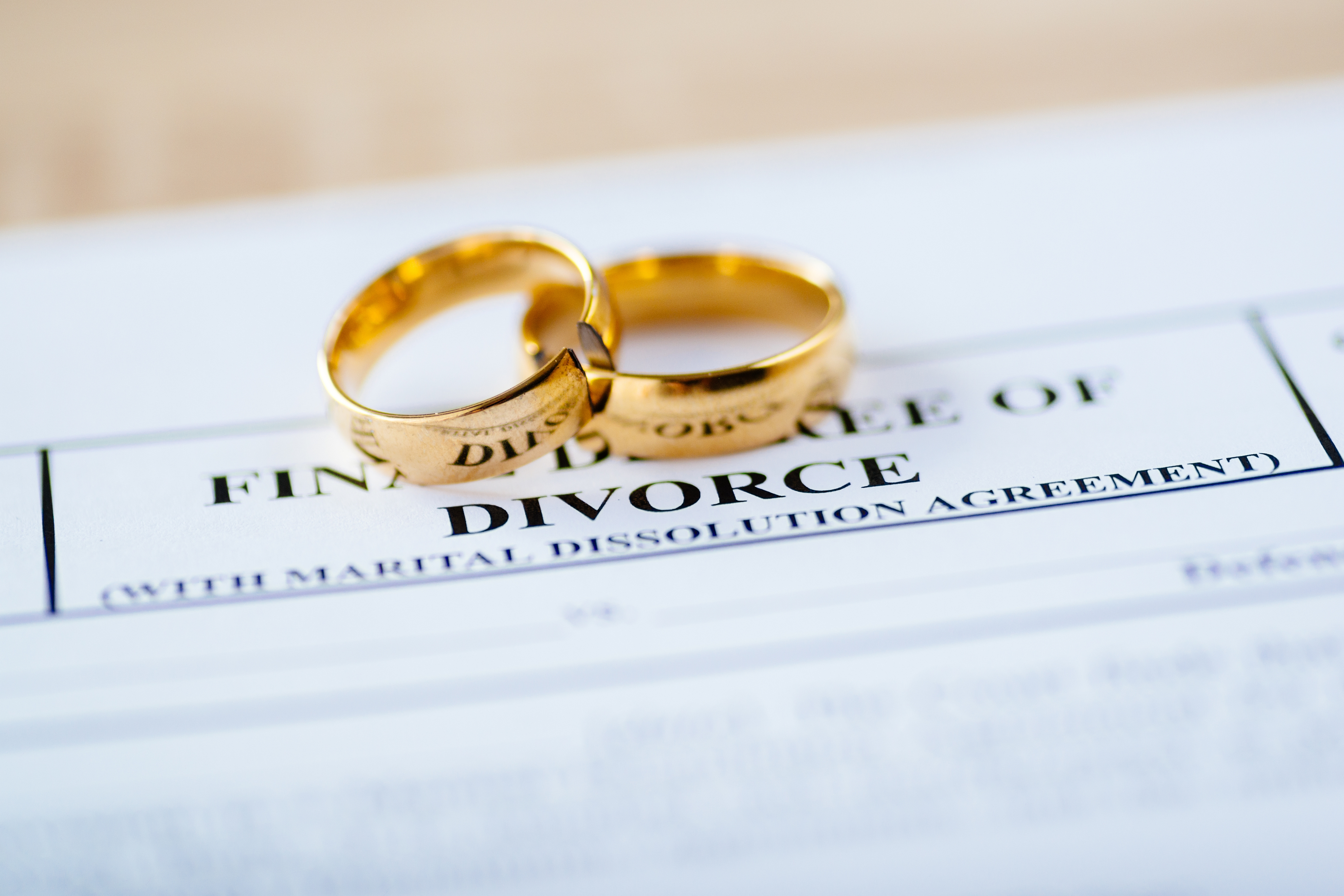 Two rings on divorce papers | Source: Shutterstock