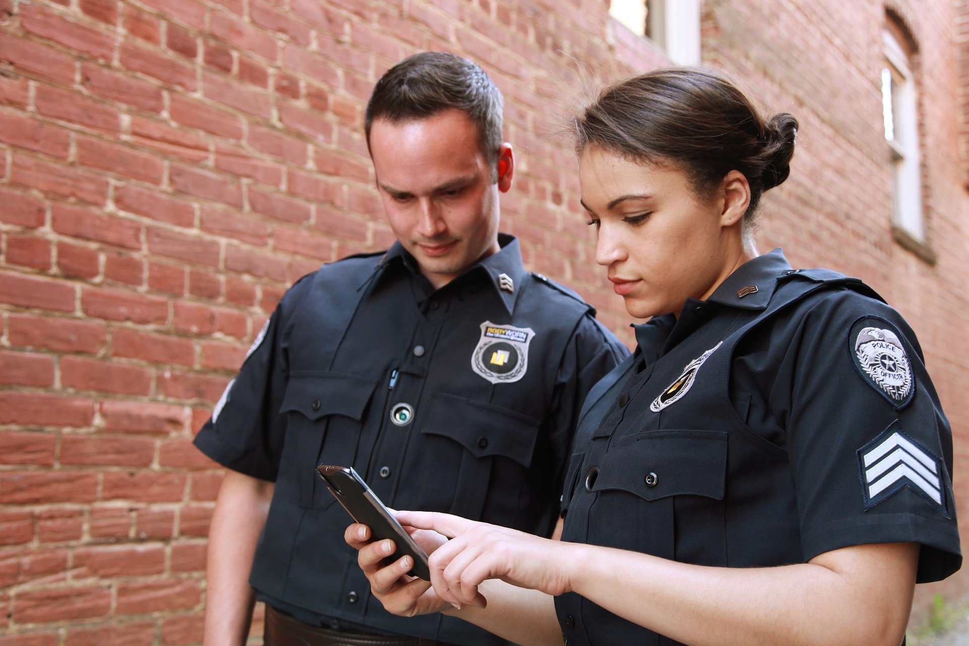 Pictured - Police officers wearing their uniforms and body cameras | Photo: Getty Images