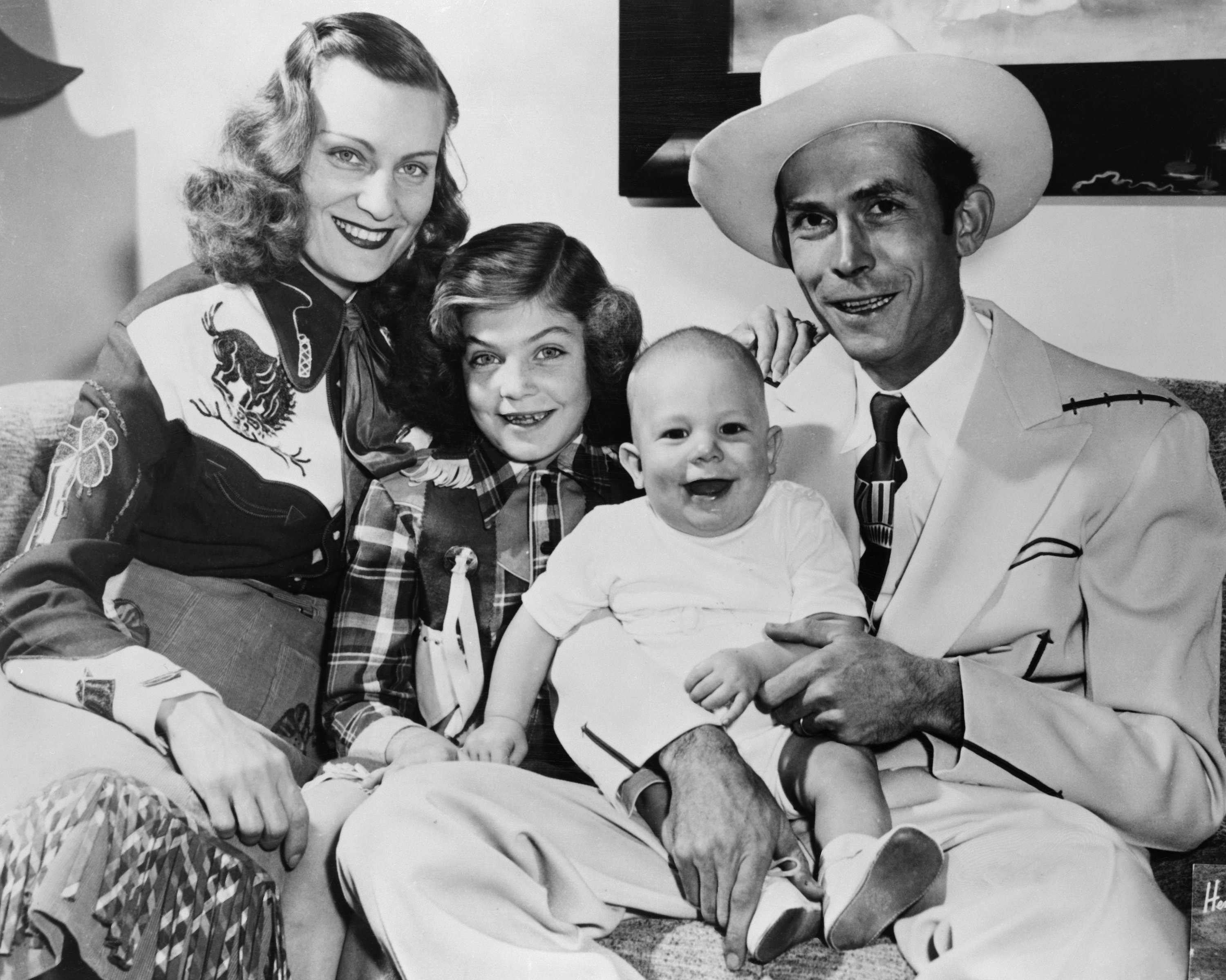 Portrait of Audrey Williams and Hank Williams Sr. with their children Lycrecia and Hank Williams Jr. | Source: Getty Images