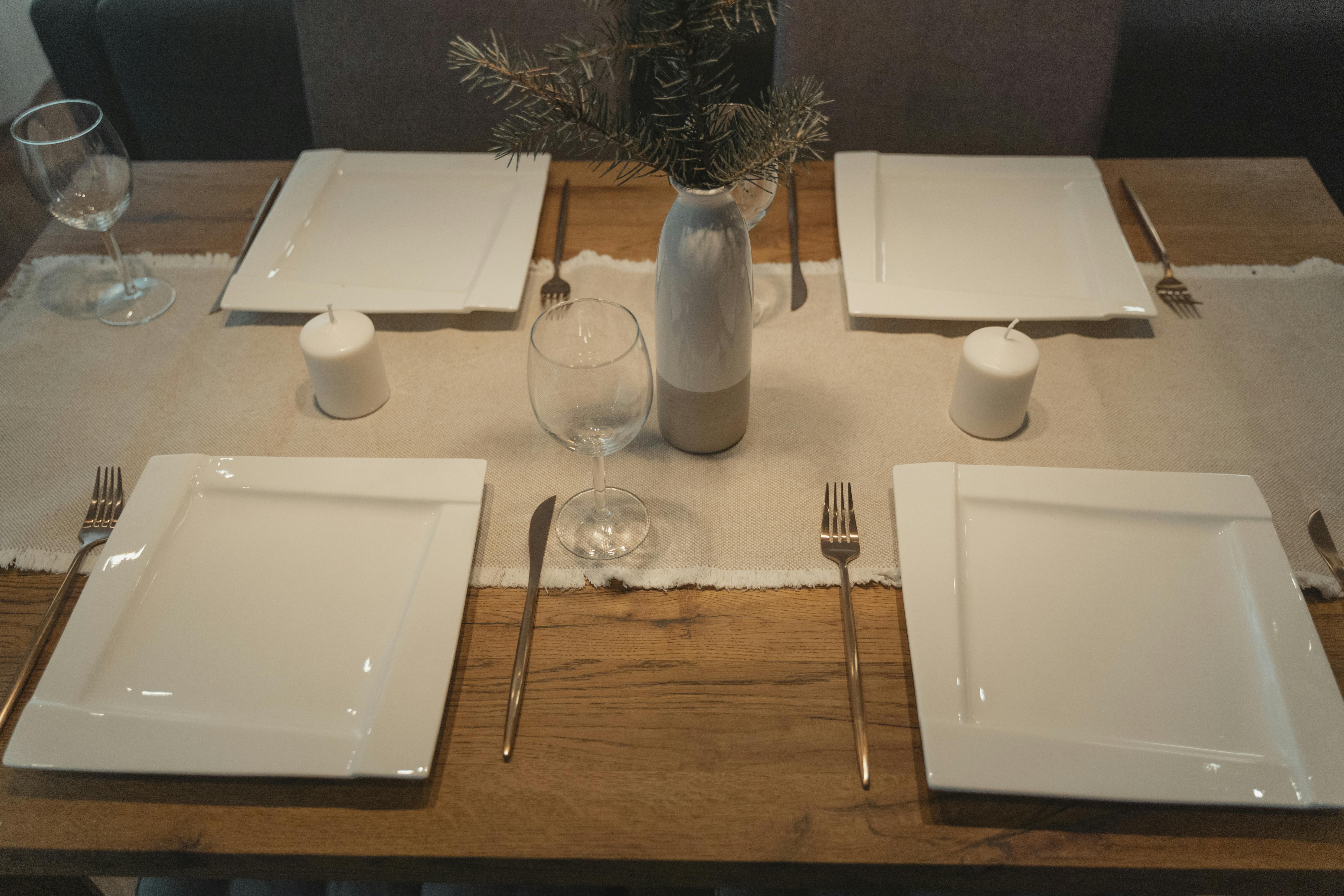 Close-up of a table set with empty plates | Source: Pexels