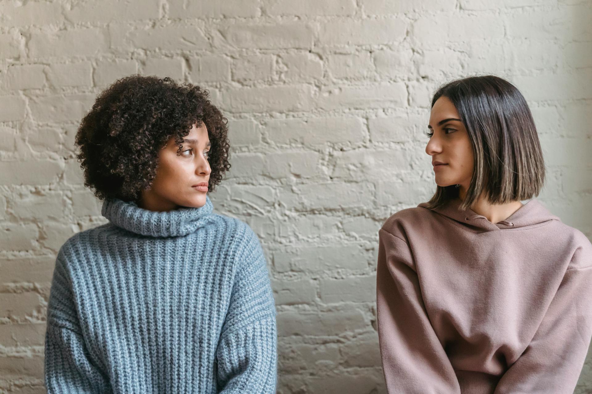 Two women share a glance | Source: Pexels