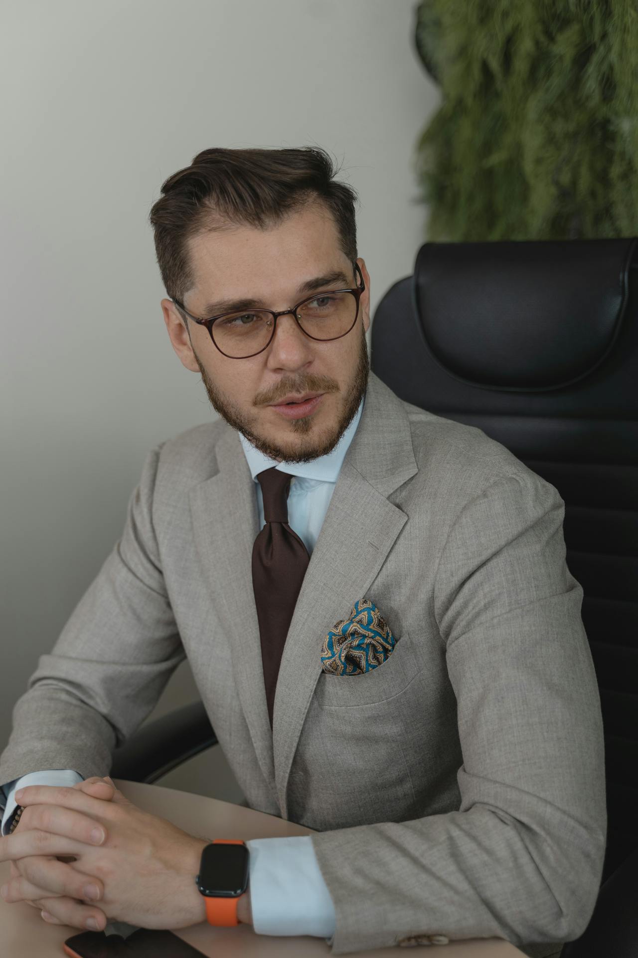 A professional man sitting in his office | Source: Pexels