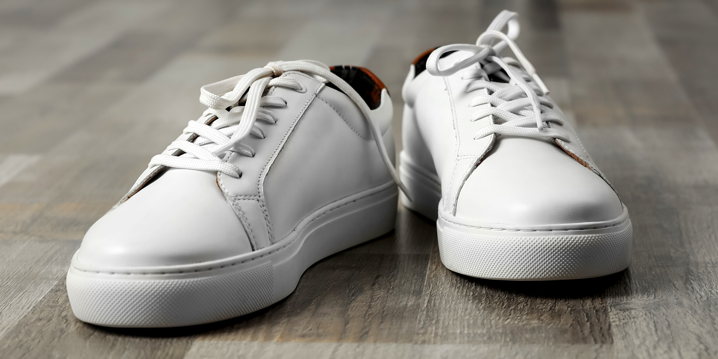 A pair of white sneakers | Source: Shutterstock