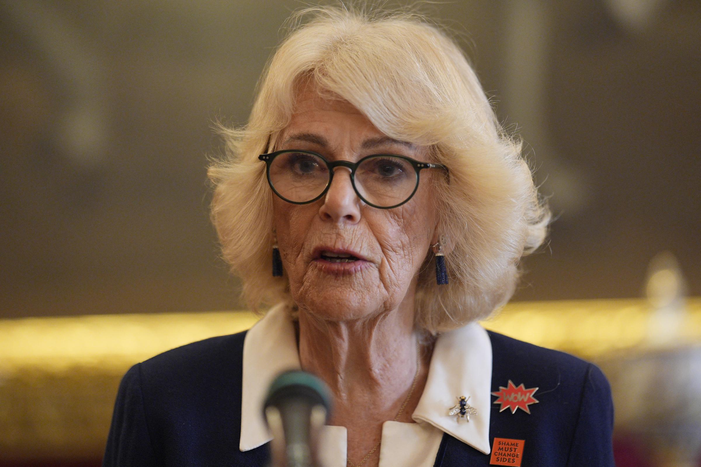 Queen Camilla addresses guests from the podium at a reception in St James's Palace to mark International Women's Day on 10 March 2026 in London, England. | Source: Getty Images