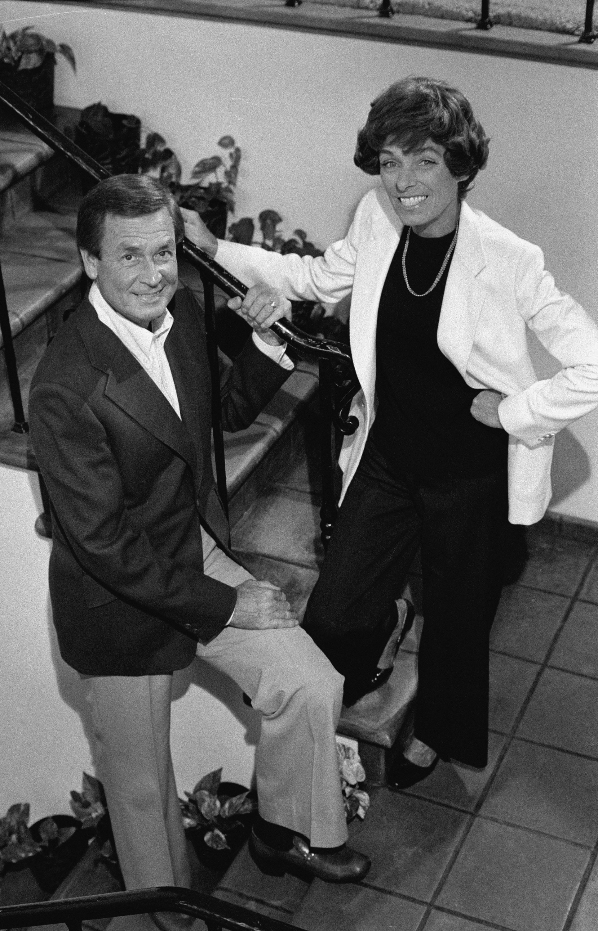 American game show host Bob Barker and his wife Dorothy Jo (1824 - 1981) pose on the stairs of their house, November 4, 1977. | Source: Getty Images