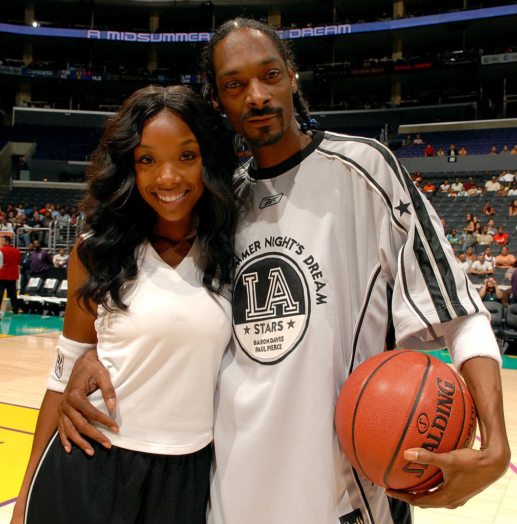 Brandy and Snoop Dogg attend the A Midsummer Night's Dream Celebrity and All-Star Basketball Game on July 9, 2006, in Los Angeles, California | Source: Getty Images (Photo by M. Caulfield/WireImage)