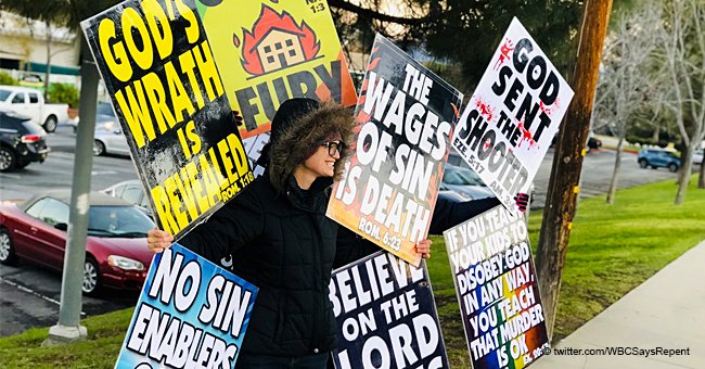 Church members take 'God sent the shooter' signs to a protest near Thousand Oaks High School