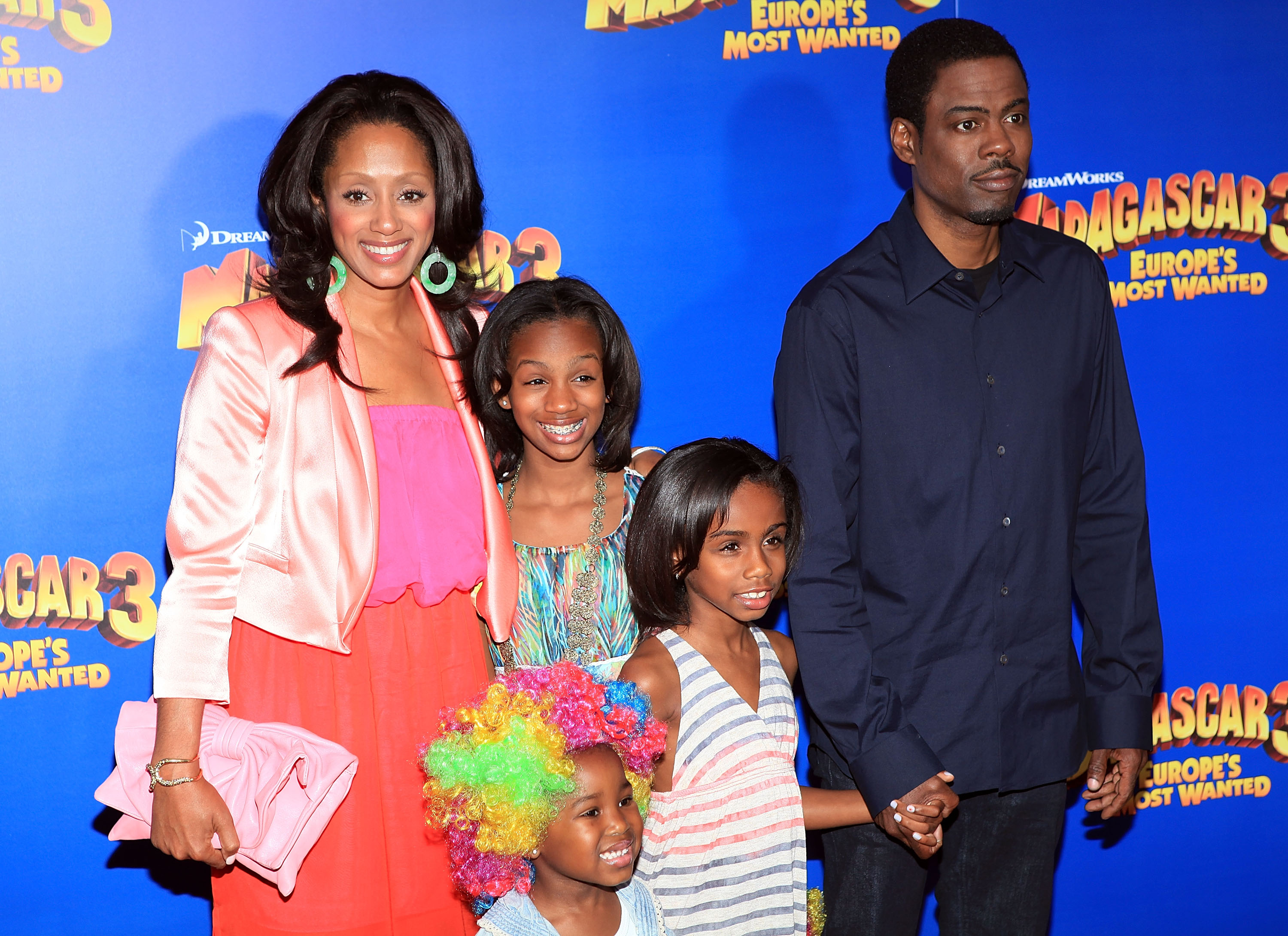(L-R) Malaak Compton-Rock, Lola Simone Rock, Zahra Savannah Rock and Chris Rock pose at the "Madagascar 3: Europe's Most Wanted" premiere at the Ziegfeld Theatre on June 7, 2012, in New York City | Source: Getty Images