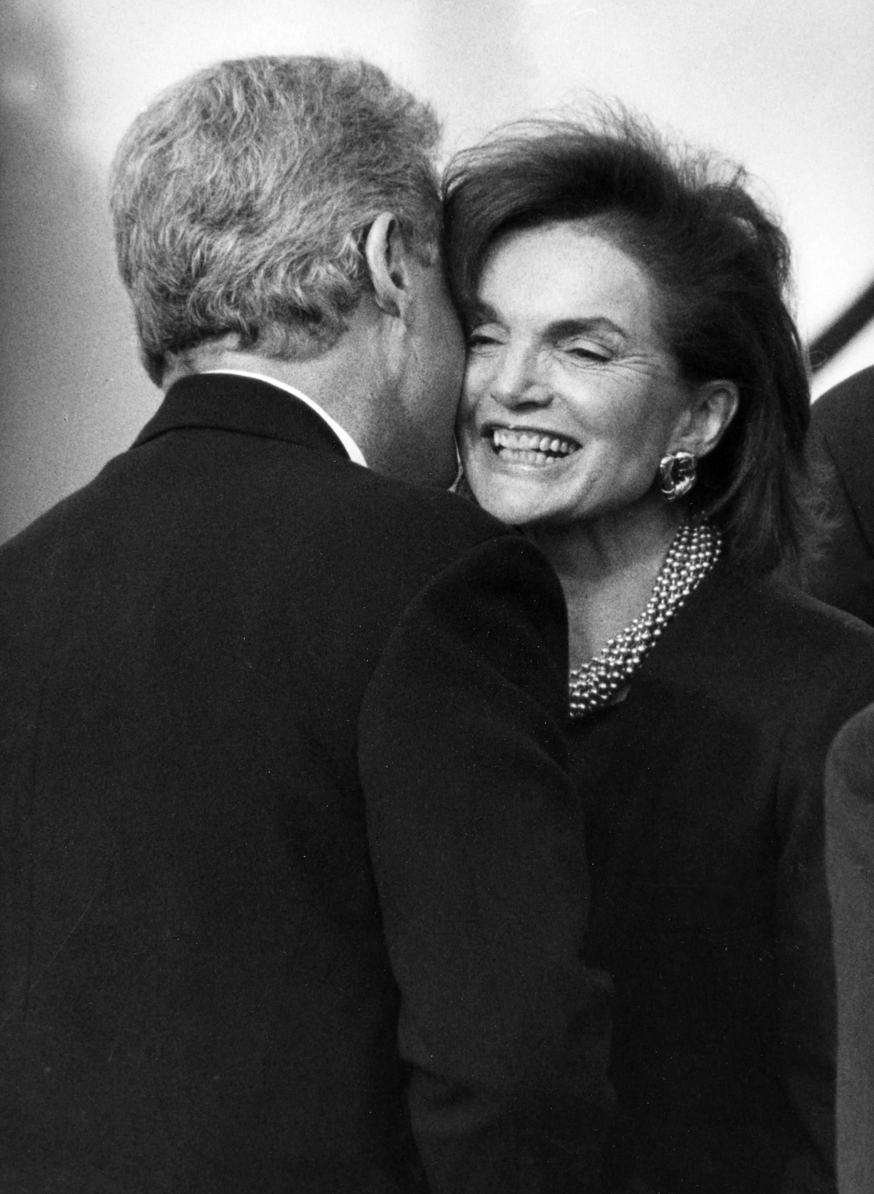 Bill Clinton greets Jacquline Kennedy Onassis at the rededication for the John F. Kennedy President Library and Museum in Boston on October 29, 1993 | Source: Getty Images