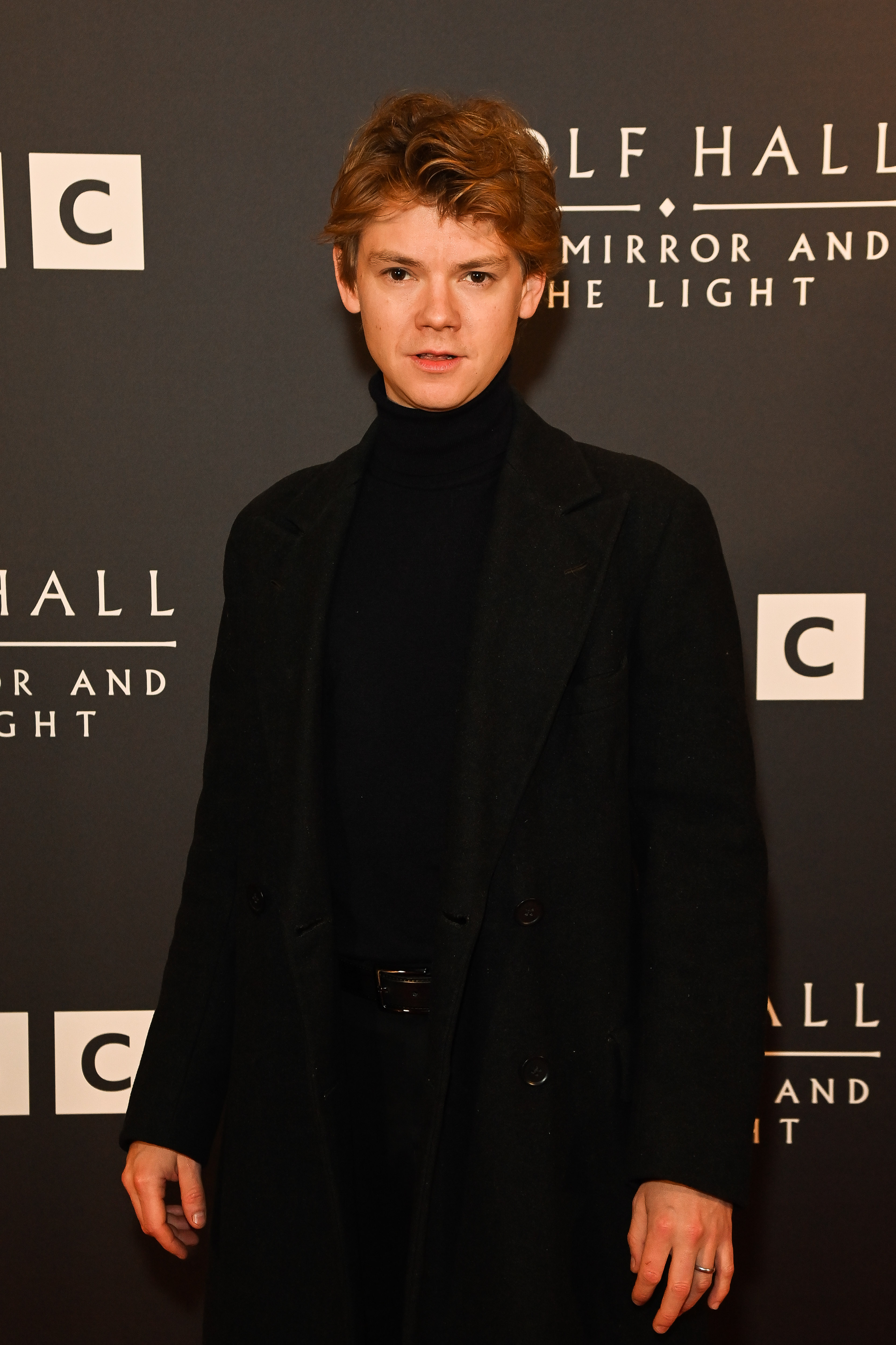 Brodie-Sangster, 34, appeared at a London photocall for "Wolf Hall: The Mirror and the Light" with his signature slender frame, tousled hair, and boyish features still firmly intact. Dressed in an all-black ensemble with a modern cut, he carried himself with a quiet intensity that leaned more cerebral than rugged — a presence that felt both refined and reserved.