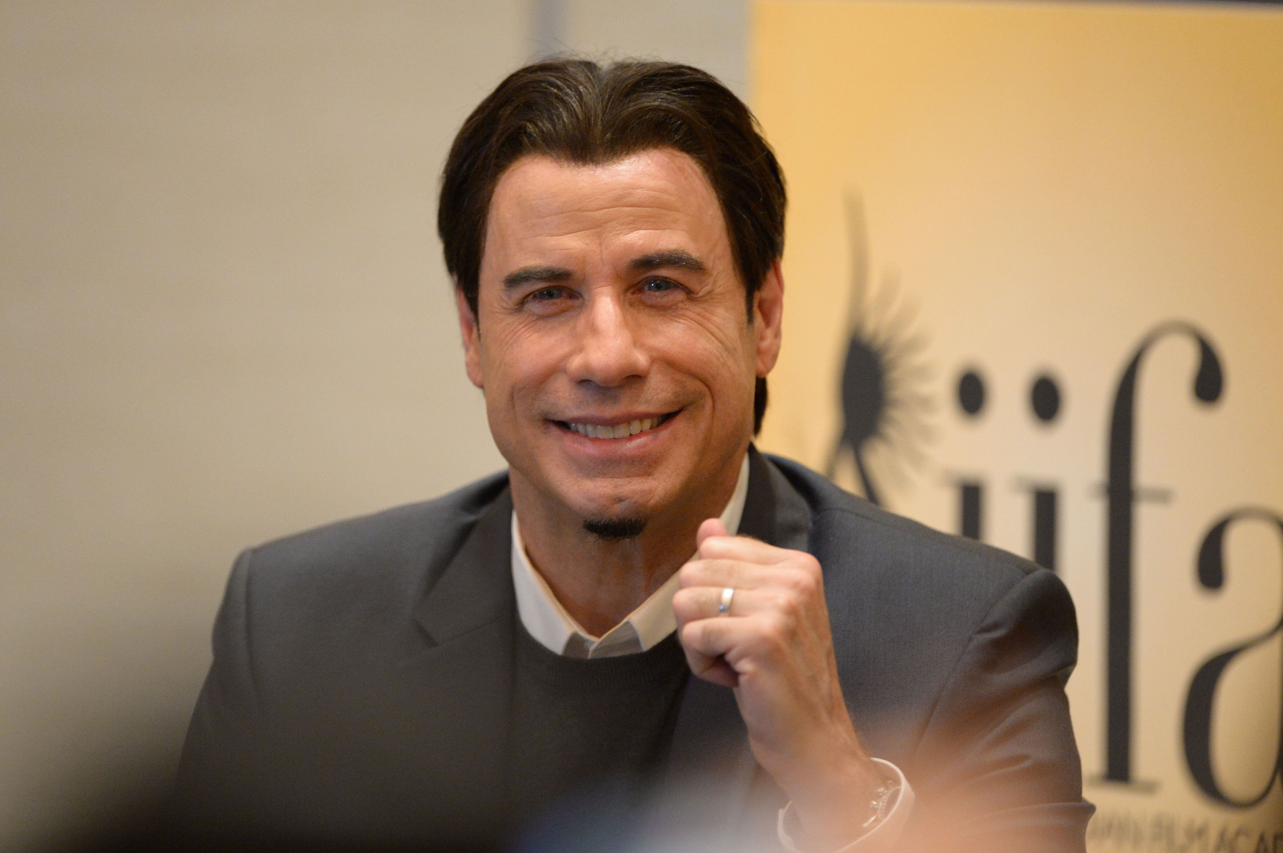 John Travolta at a press conference during the IIFA Awards week on April 26, 2014, in Tampa, Florida | Photo: Gustavo Caballero/Getty Images