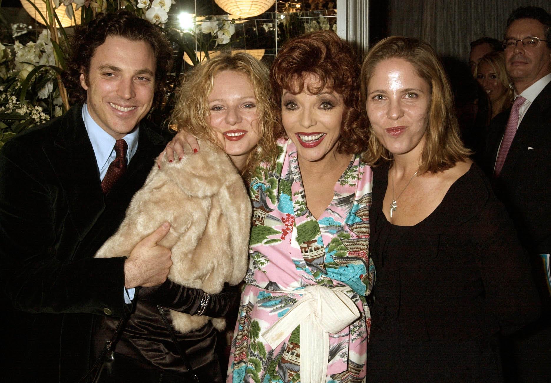 Joan Collins with her children Alexander (Sacha) Newley, Tara Newley and Katyana Kass, attending the first night of "Over The Moon" at The Waldorf Hotel, London on October, 16, 2001. | Source: Getty Images