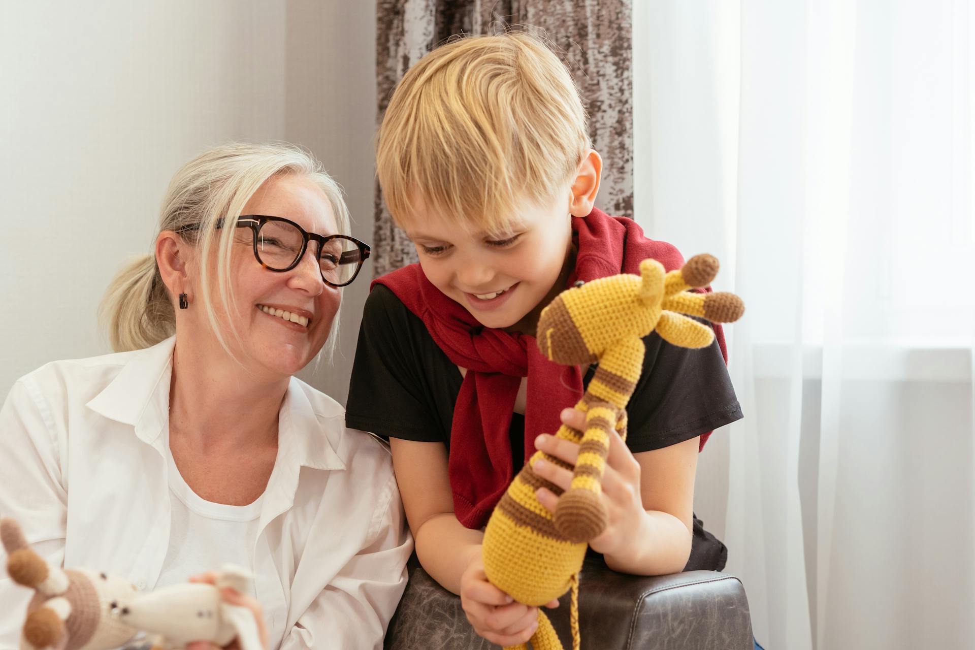 An elderly woman with her grandson | Source: Pexels