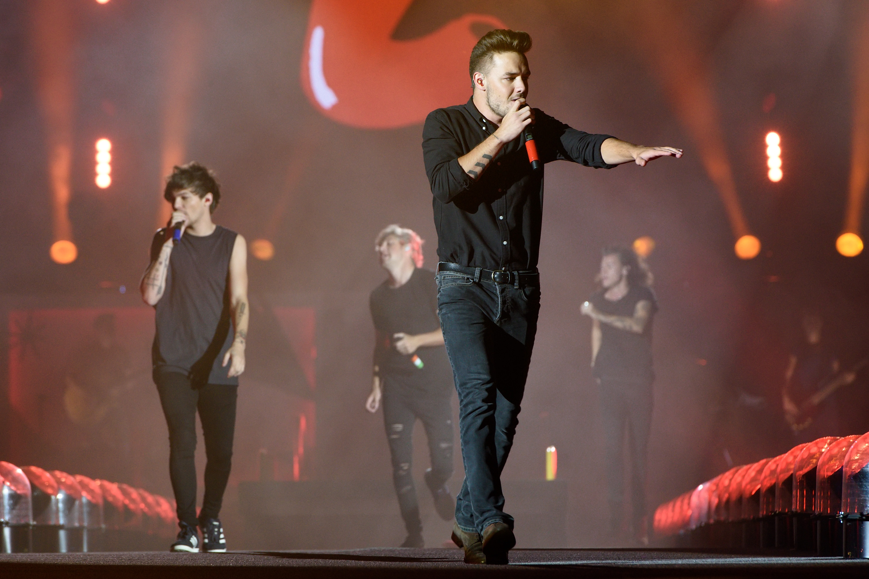 Louis Tomlinson, Niall Horan, Liam Payne, and Harry Styles perform at Soldier Field in Chicago on August 23, 2015 | Source: Getty Images