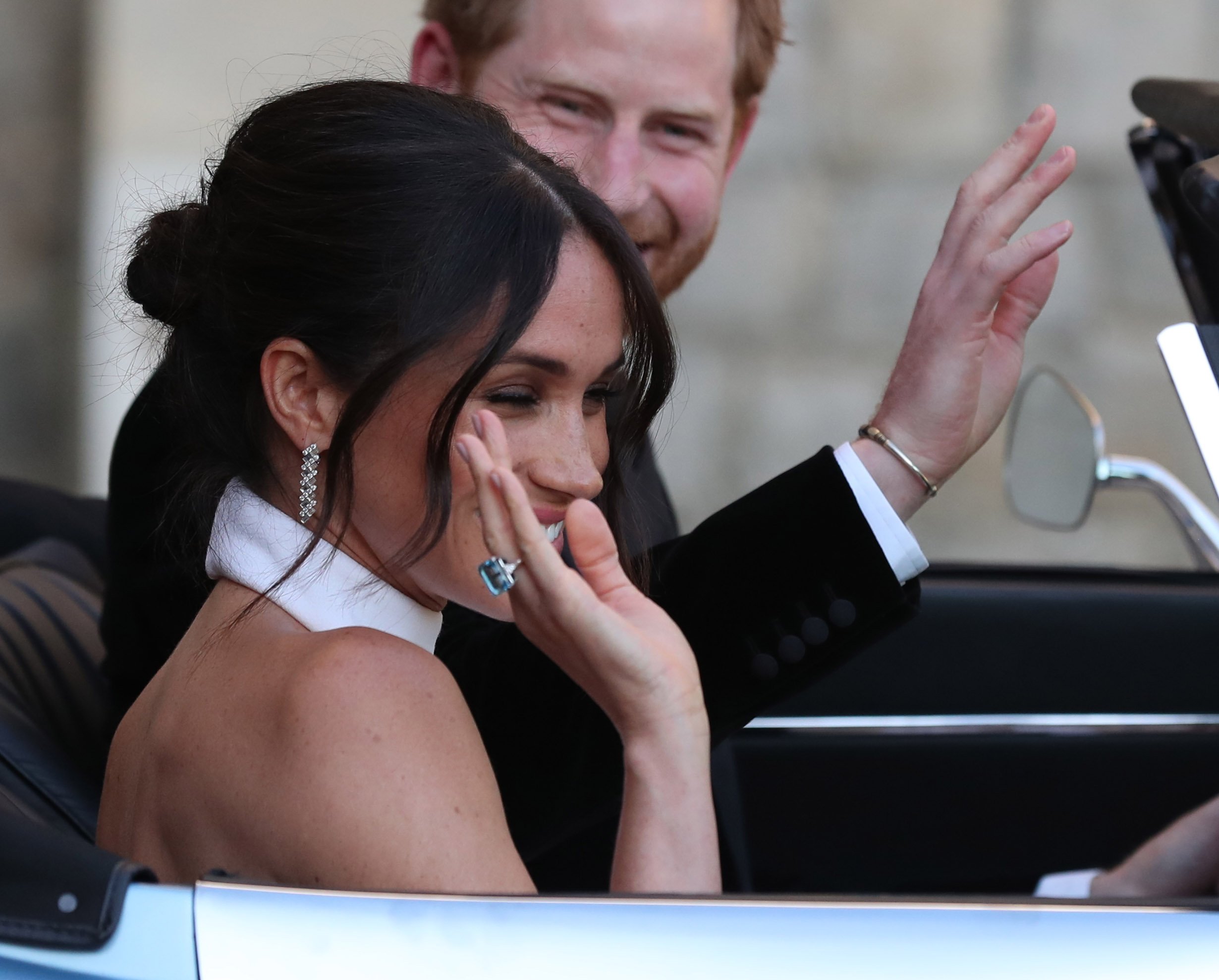 Duchess of Sussex and Prince Harry leave Windsor Castle after their wedding to attend an evening reception at Frogmore House on May 19, 2018, in Windsor, England. | Source: Steve Parsons - WPA Pool/Getty Images