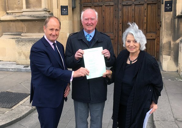 Kevin Hollinrake MP, Peter Lawrence and Baroness Hamwee holding a copy of Claudia's Law. | Photo: Getty Images