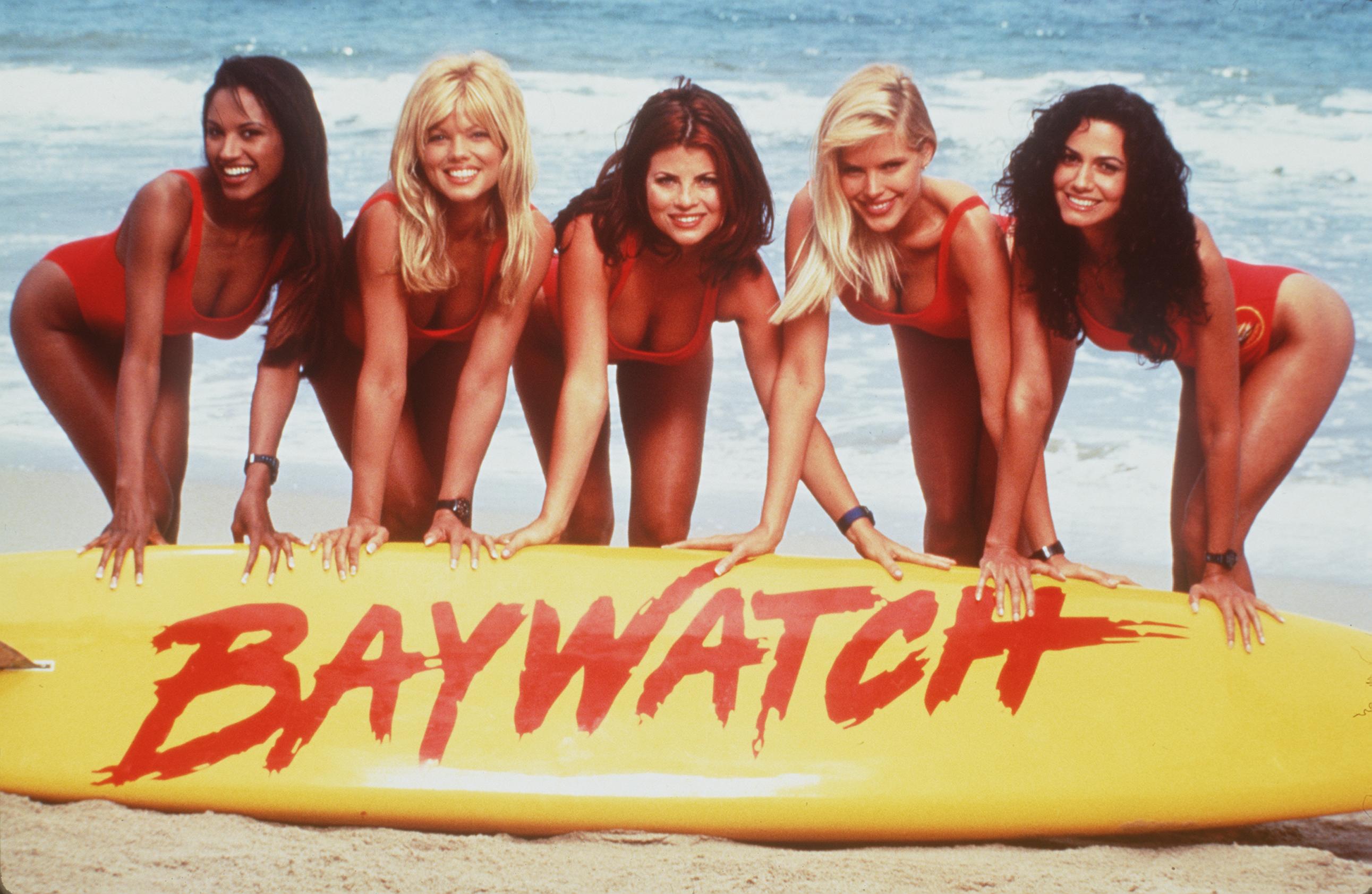 From L-R: Traci Bingham, Donna D'Errico, Yasmine Bleeth, Gena Lee Nolin and Nancy Valen in the set of "Baywatch," 1999 | Source: Getty Images