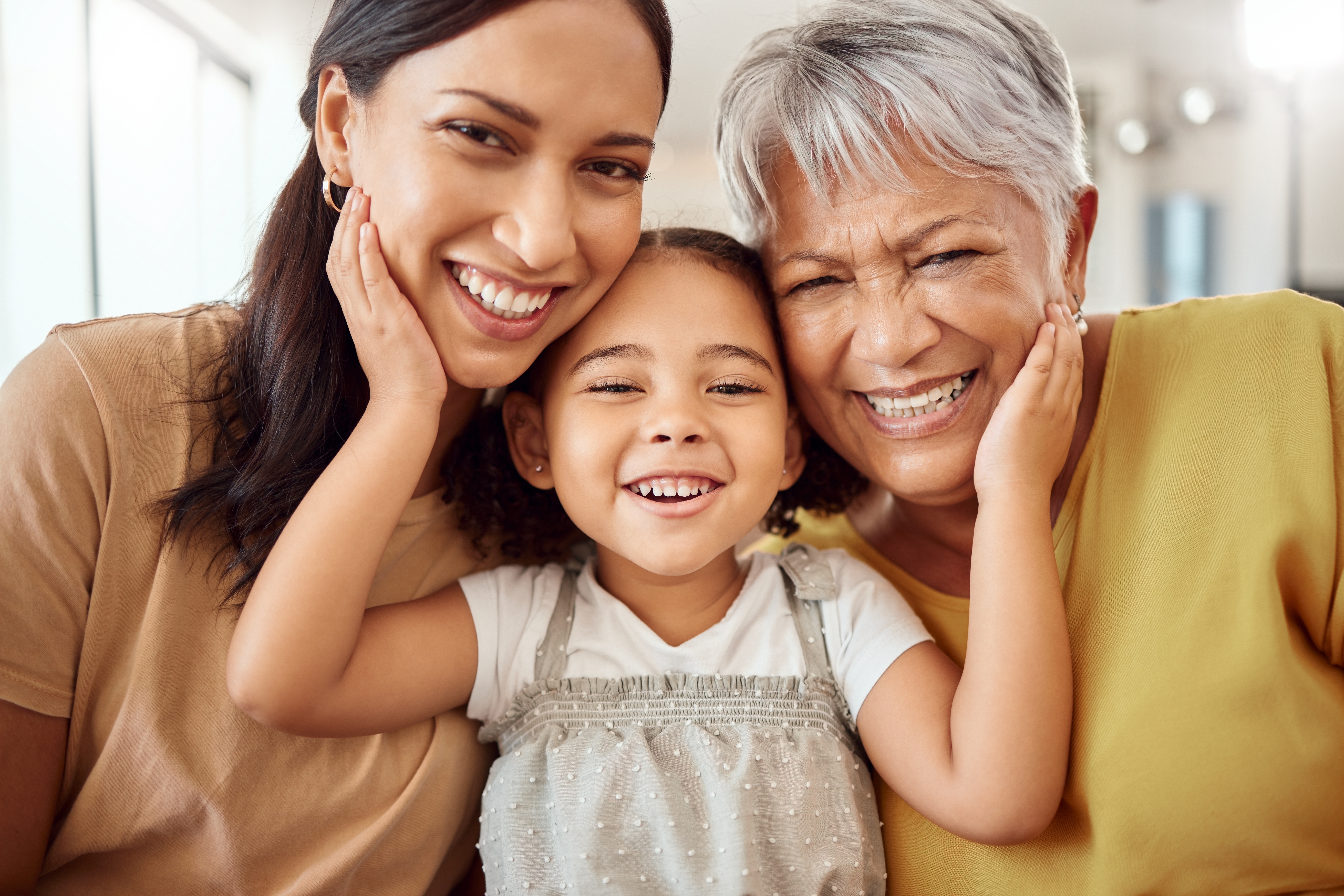 Three generations of women smiling | Source: Shutterstock