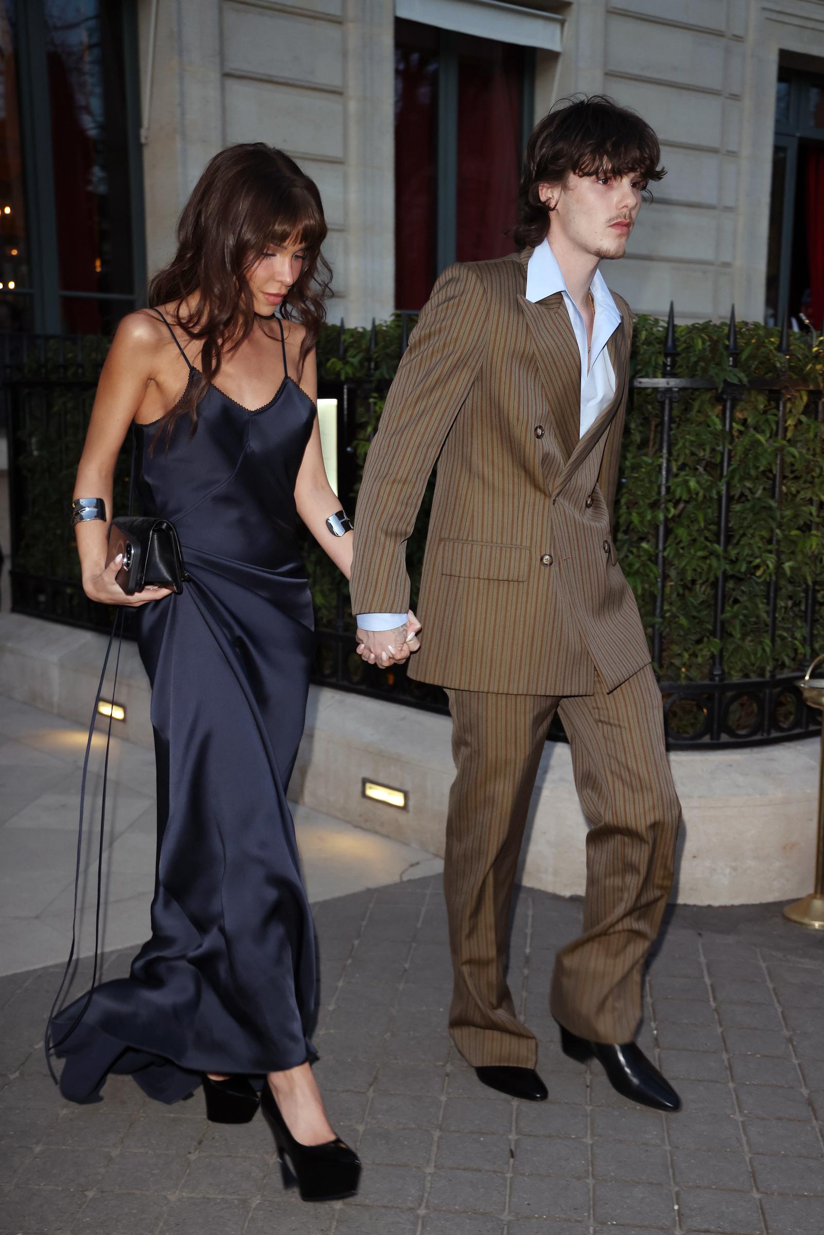 On the night of March 7th, sleek and runway-ready, Apostel and Beckham leave their Paris hotel, en route to the Victoria Beckham show during the Womenswear Fall/Winter 2025/2026 season.