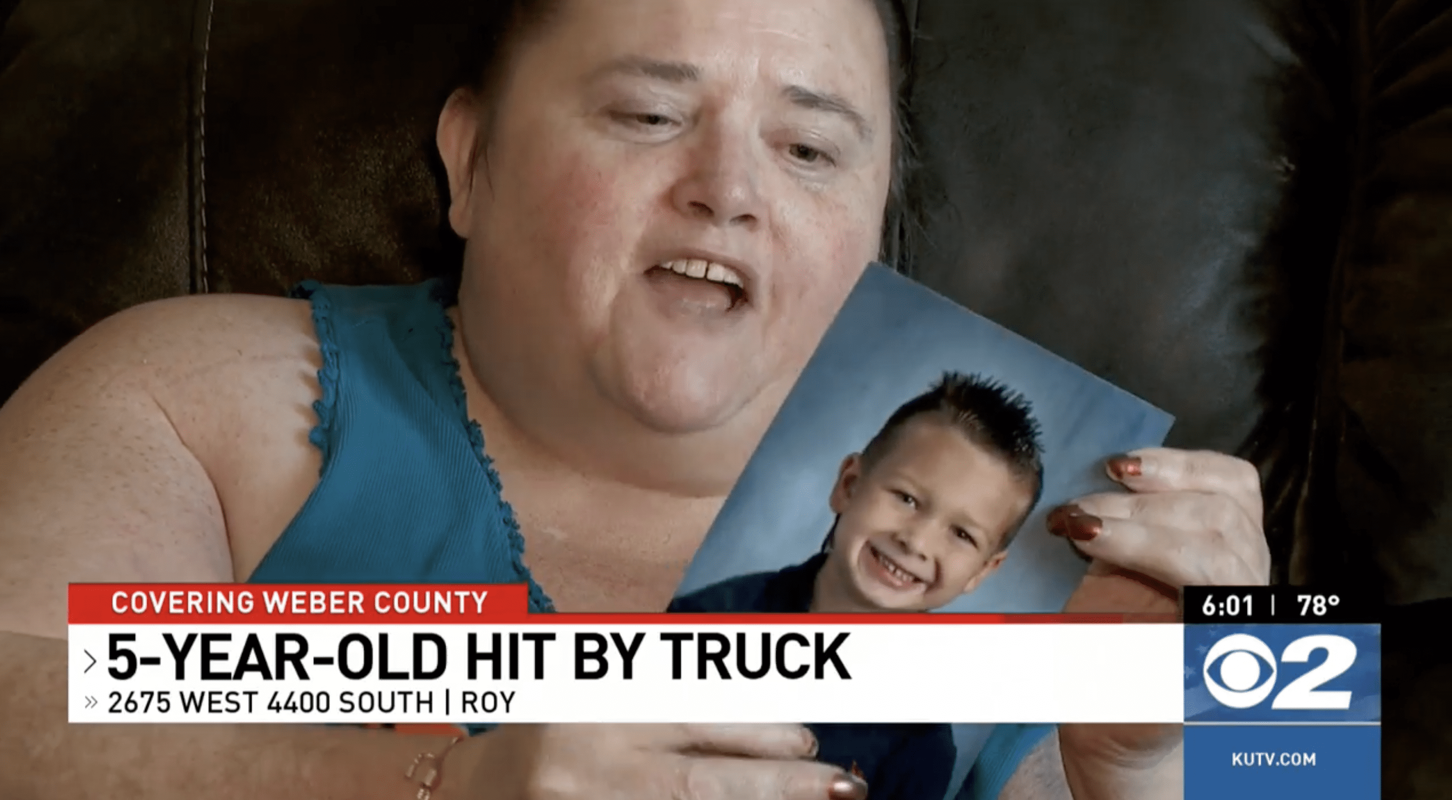 A teary-eyed April Roberts holds a photo of her grandson, Bentley Roberts. | Source: facebook.com/DanielMWoodruff