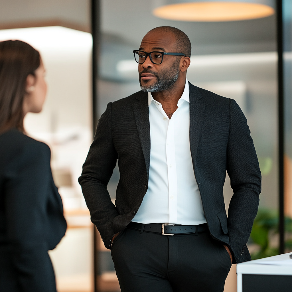 A boss talking to his female employee | Source: Midjourney