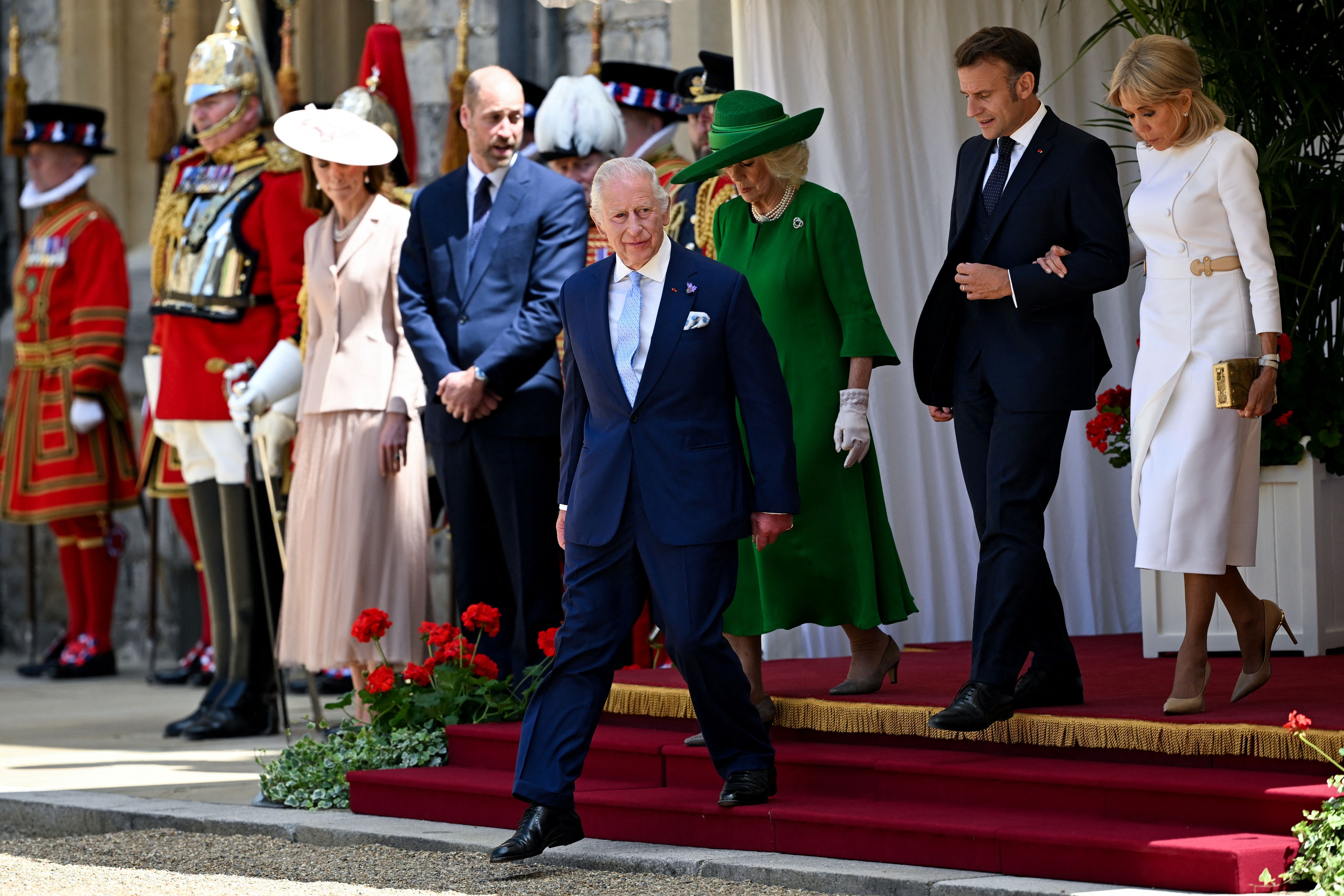 Princess Catherine, Prince William, King Charles III, Queen Camilla, President Emmanuel Macron, and First Lady Brigitte Macron stand together on the Royal Dais during the opening ceremony of the French delegation's official state visit to the United Kingdom.
