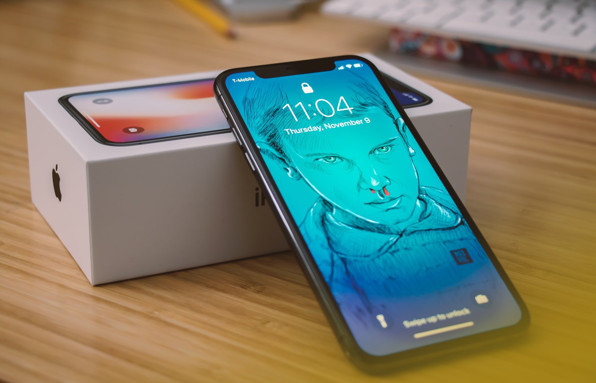 Brand new iPhone X with box on table | Source: Unsplash
